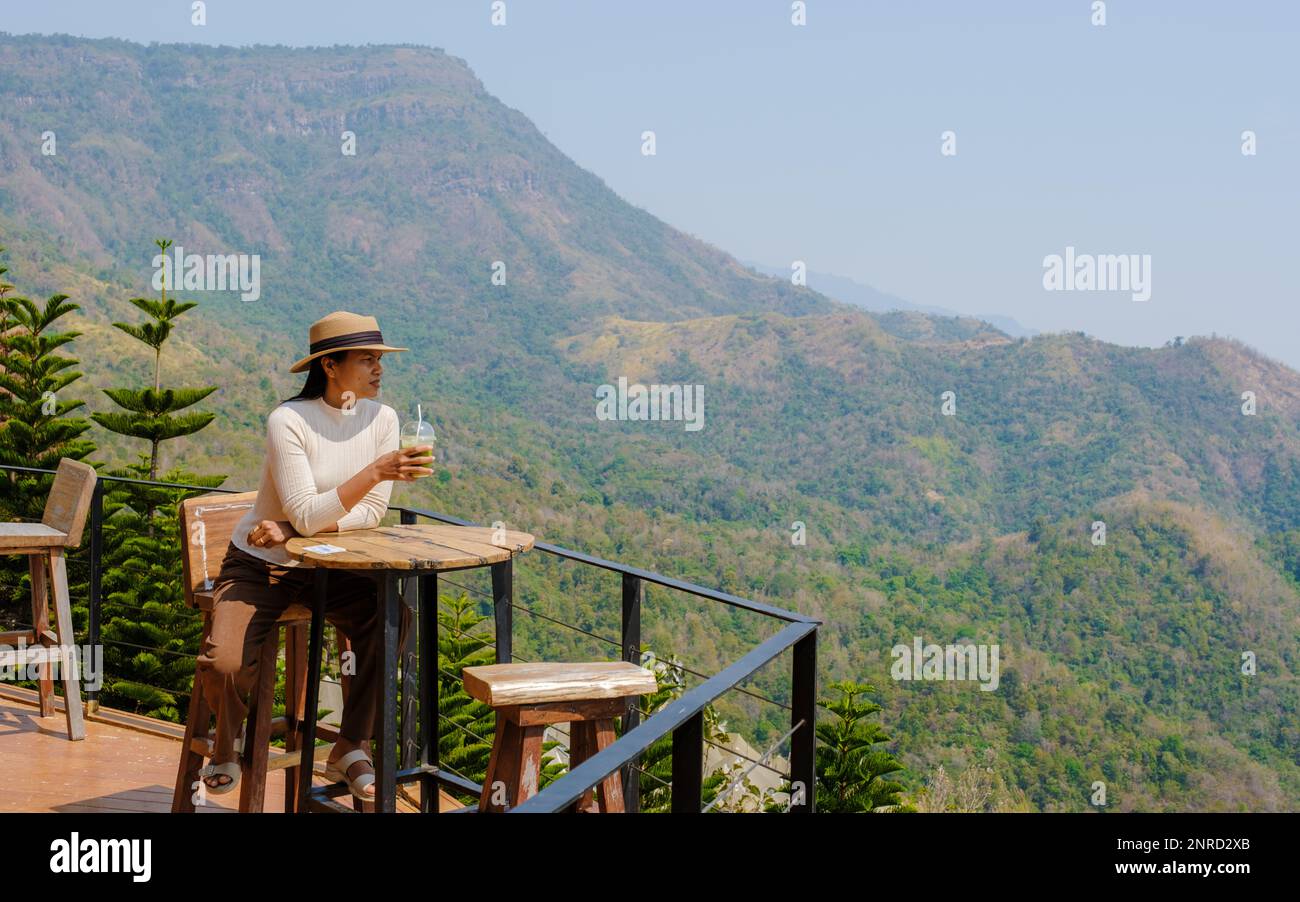 women drinking Thai tea in a cafe in the mountains of Phetchabun Kha ...