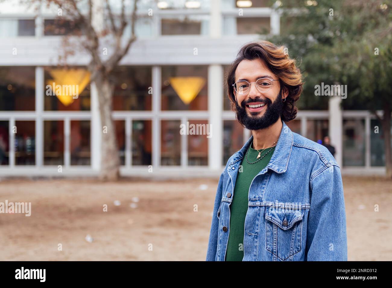 man with beard smiling looking at camera Stock Photo