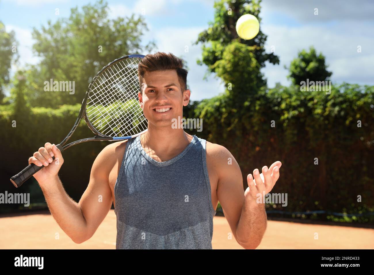 Man Using Tennis Racket Tennis racket ball clothes hi-res stock photography and images - Alamy