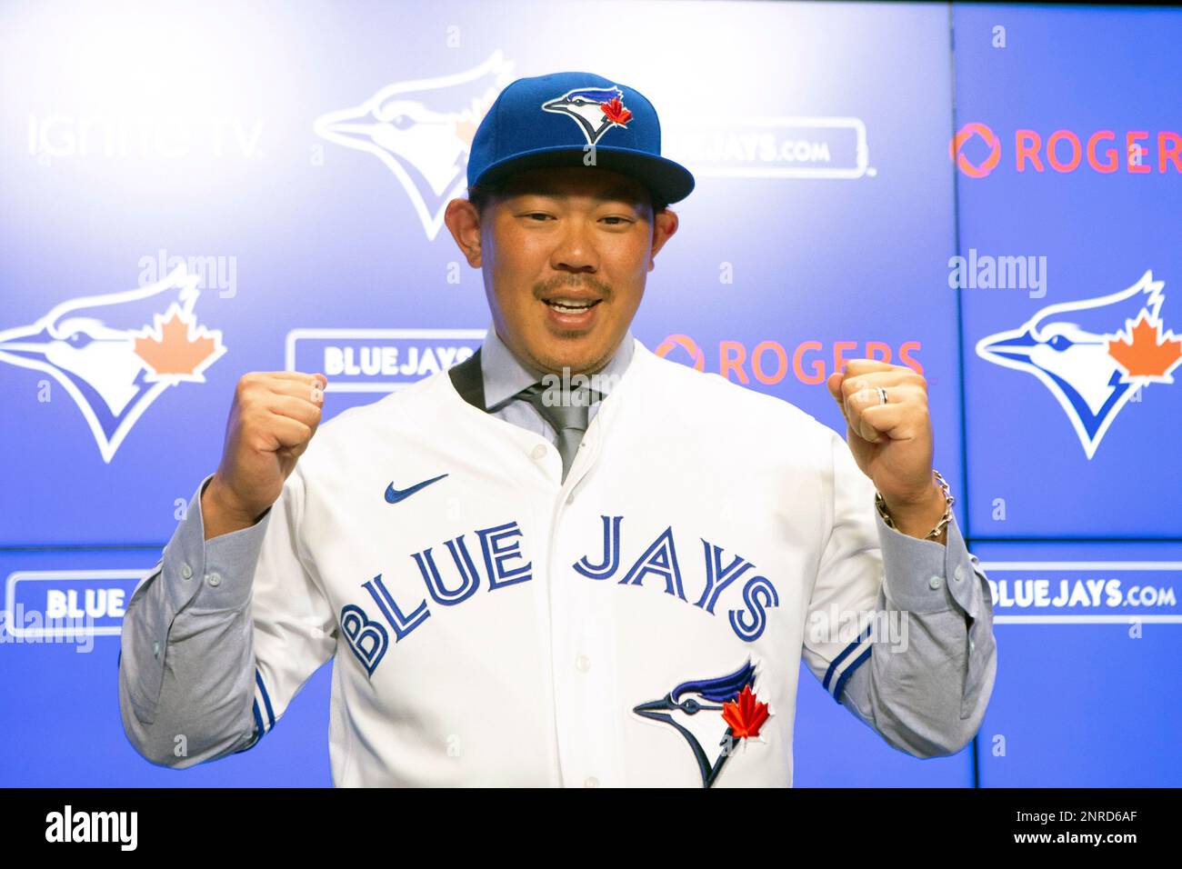Toronto Blue Jays newly signed pitcher Hyun-Jin Ryu, right, holds