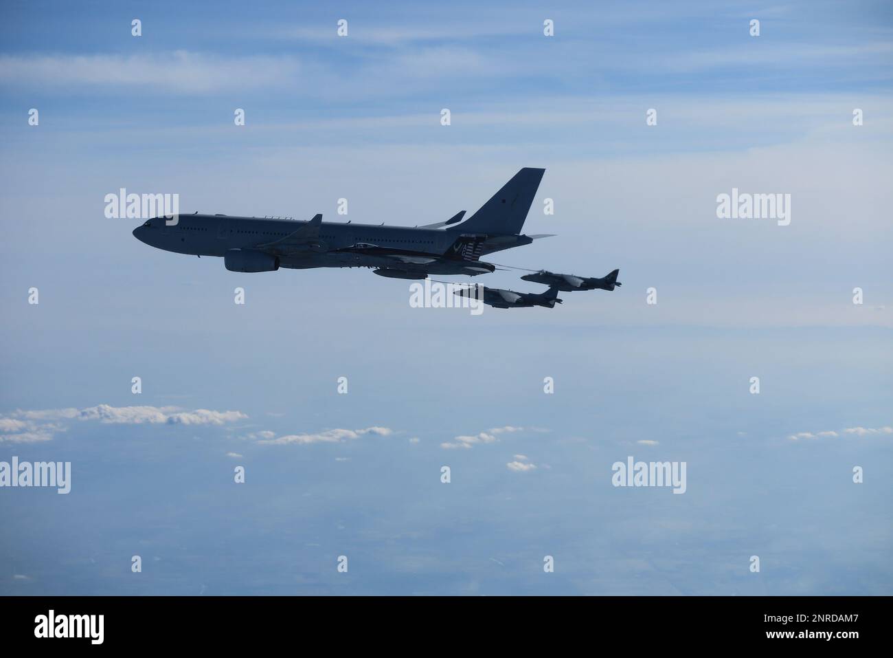 230222-N-NO777-1002 SLOVAKIA (Feb. 22, 2023) A Royal Air Force A330 tanker refuels two Spanish Navy AV-8B Harriers during combined long range strike training, Feb. 22, 2023. The George H.W. Bush Carrier Strike Group is on a scheduled deployment in the U.S. Naval Forces Europe area of operations, employed by U.S. Sixth Fleet to defend U.S., allied, and partner interests. (U.S. Navy courtesy photo) Stock Photo