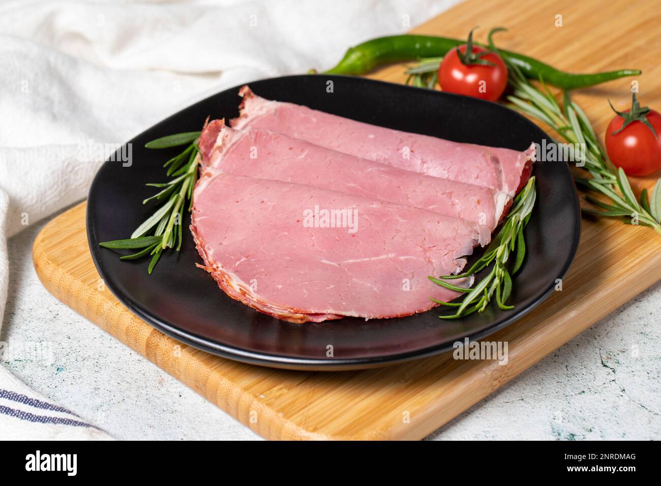 Beef salami slice in plate. Dried smoked ribeye salami. close up Stock