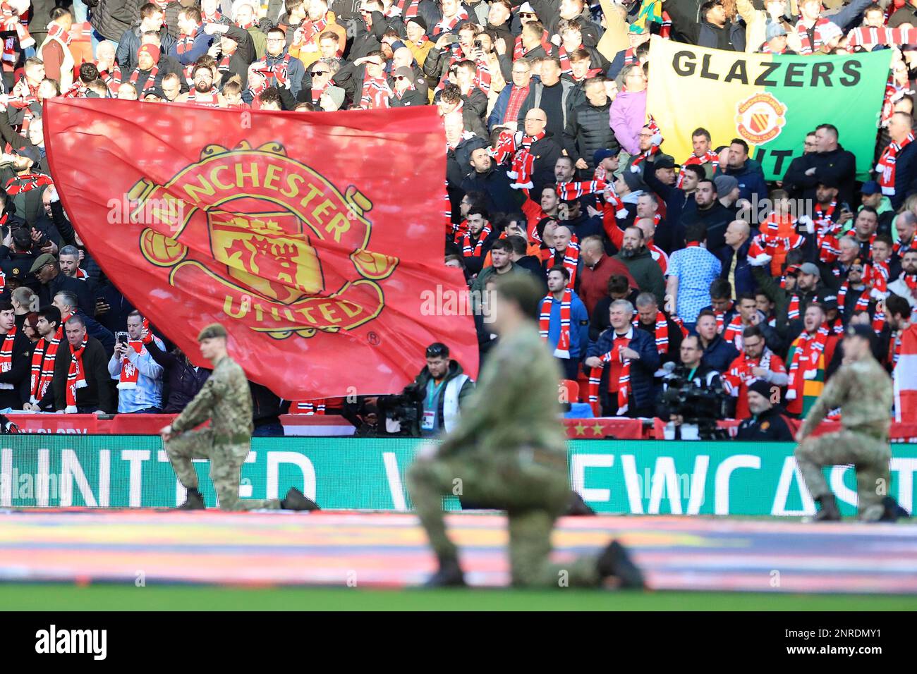 Manchester United fans wave flags during the EFL Carabao Cup Final