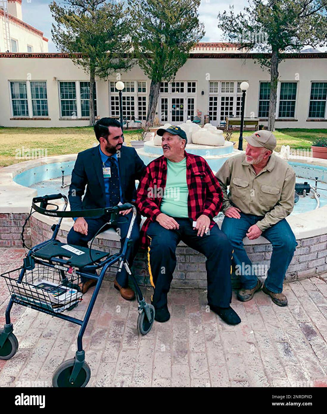 In this Jan. 4, 2020, photo, U.S. Army veteran Mark Bartoloni, center