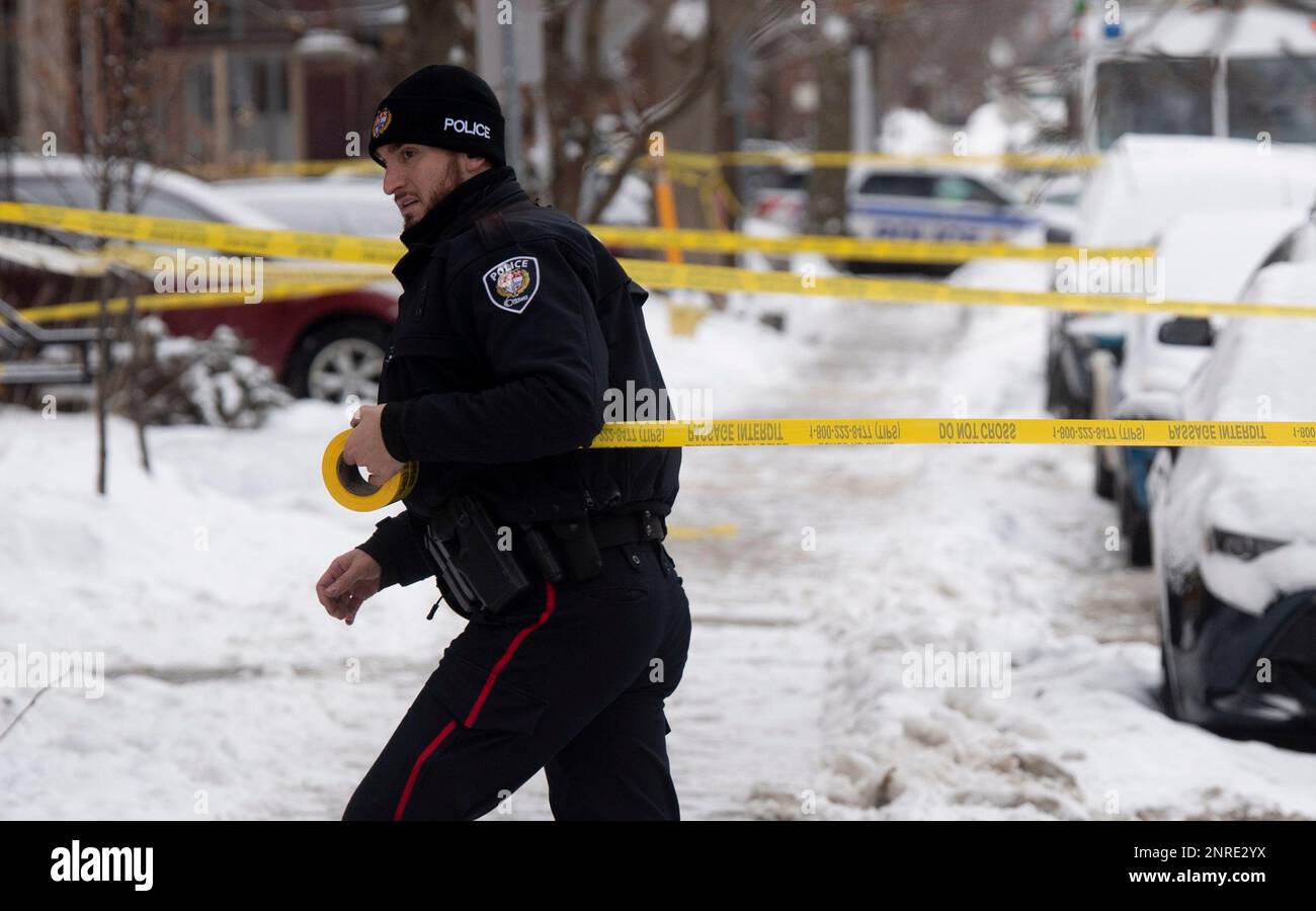 Police inspect the scene of a shooting in downtown Ottawa on Wednesday ...