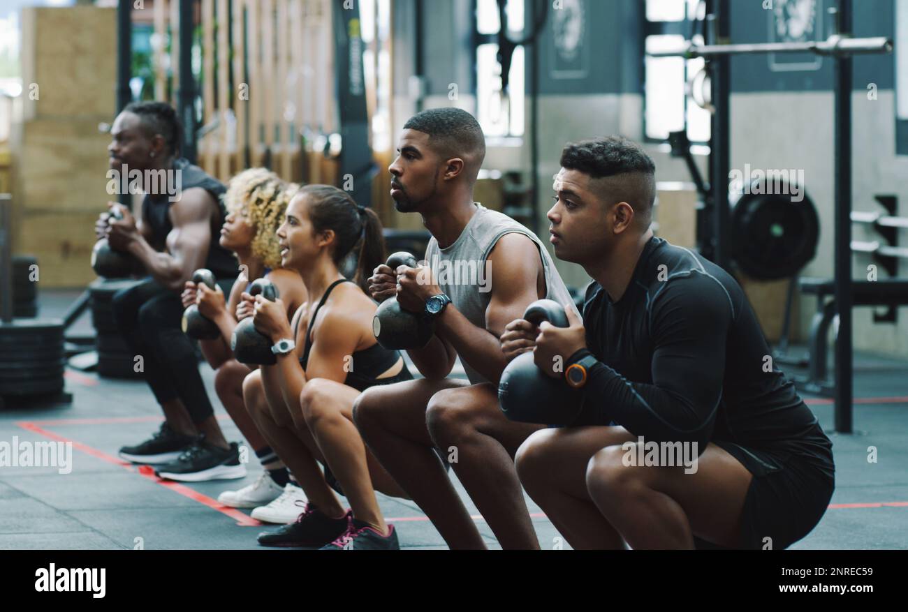 Working out a range of muscles with kettlebell training. a group of
