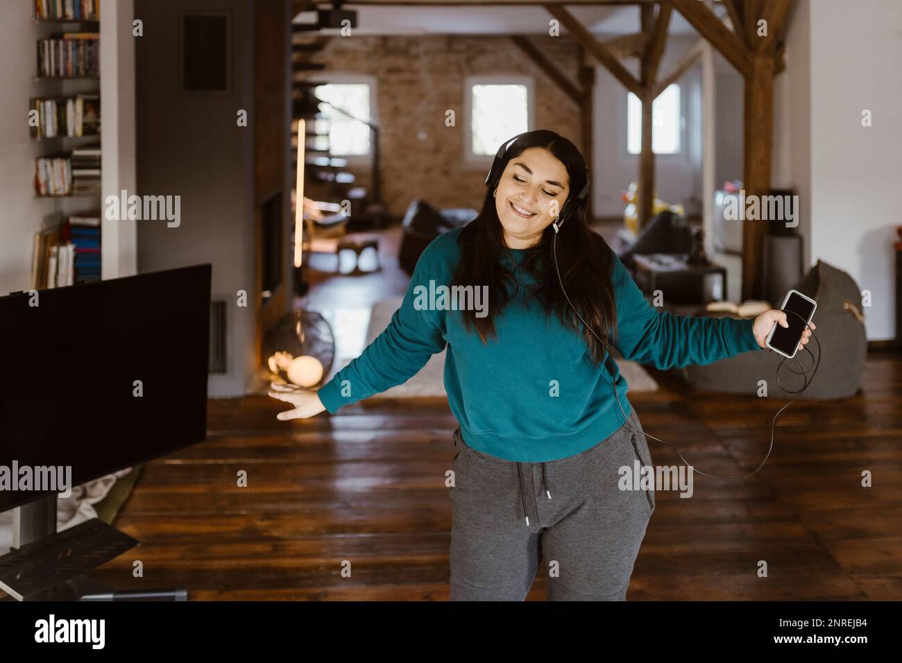 Woman dancing living room hi-res stock photography and images - Alamy