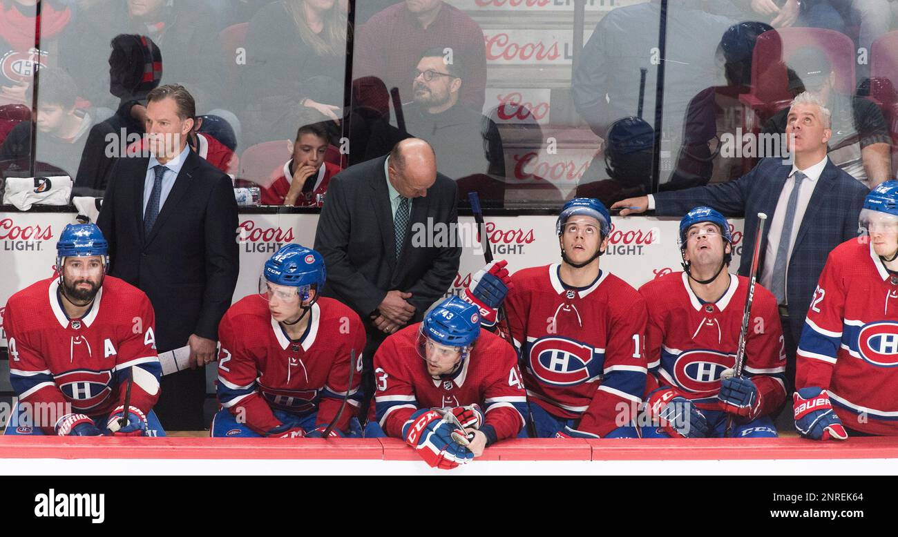 Montreal Canadiens coaches and players watch during the third period of the team's NHL hockey