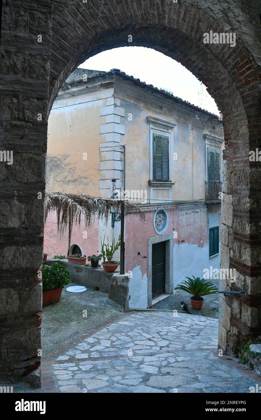 A narrow street among the old houses of Pietravairano, a rural town in