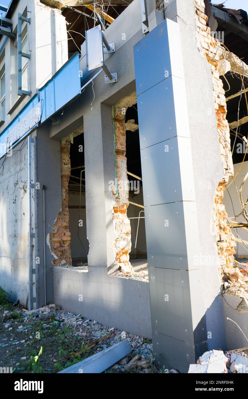 Background of process of demolition of building. Excavator breaking old ...