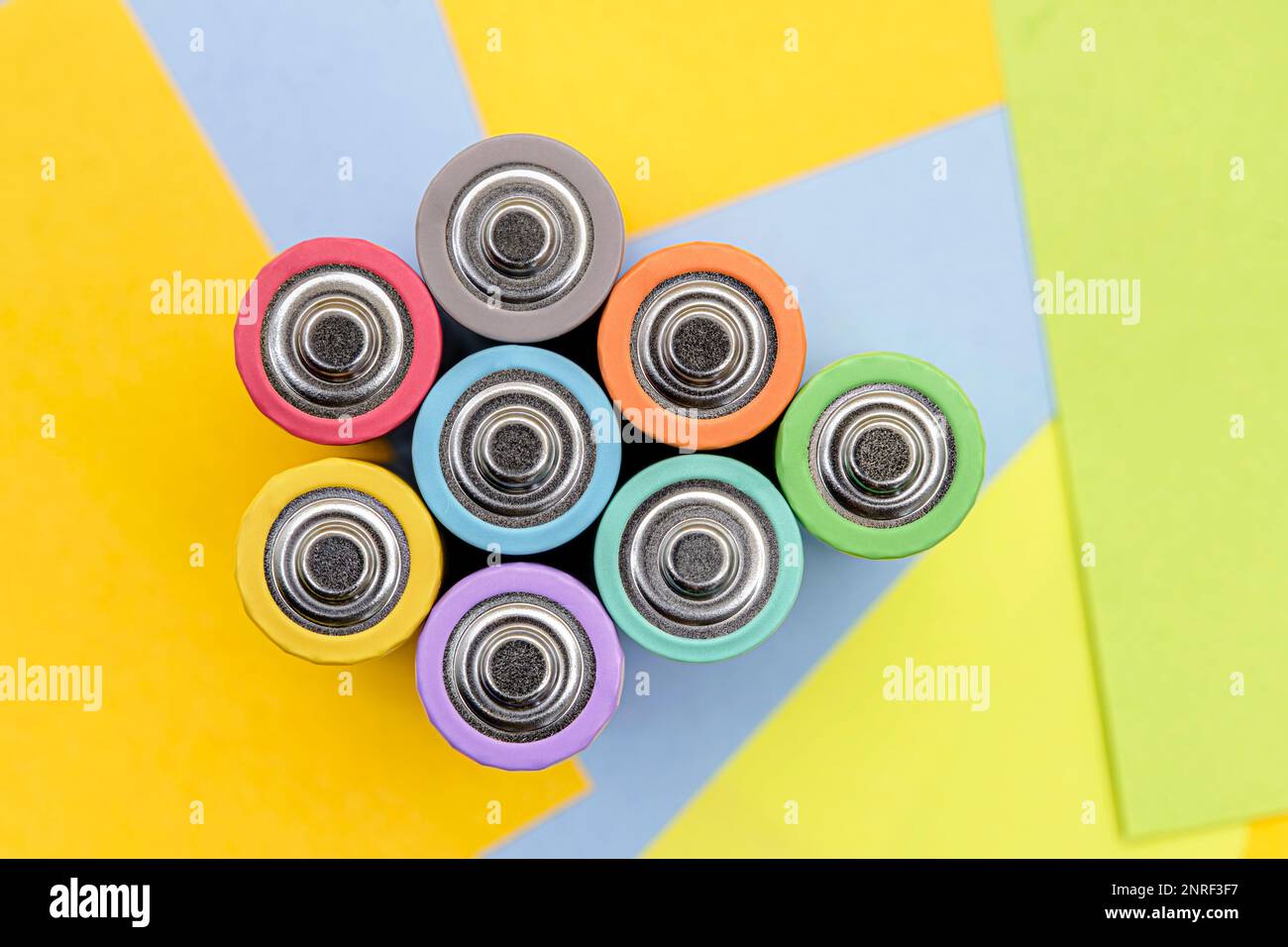 Cylindrical batteries of various colors with multicolored paper sticky ...