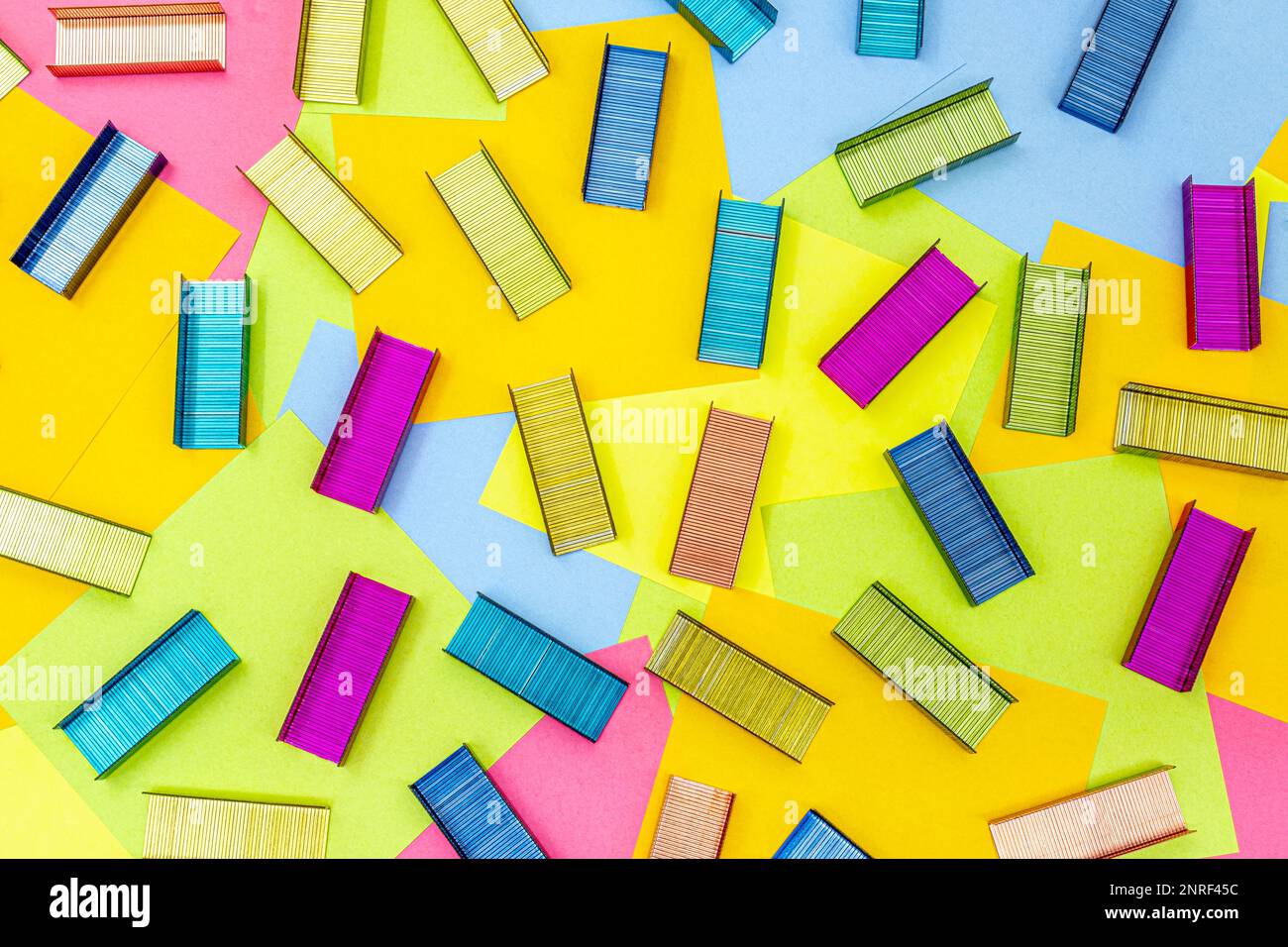 Multicolored office metal staples for stapler on multicolored paper Sticky Notes, post it Stock