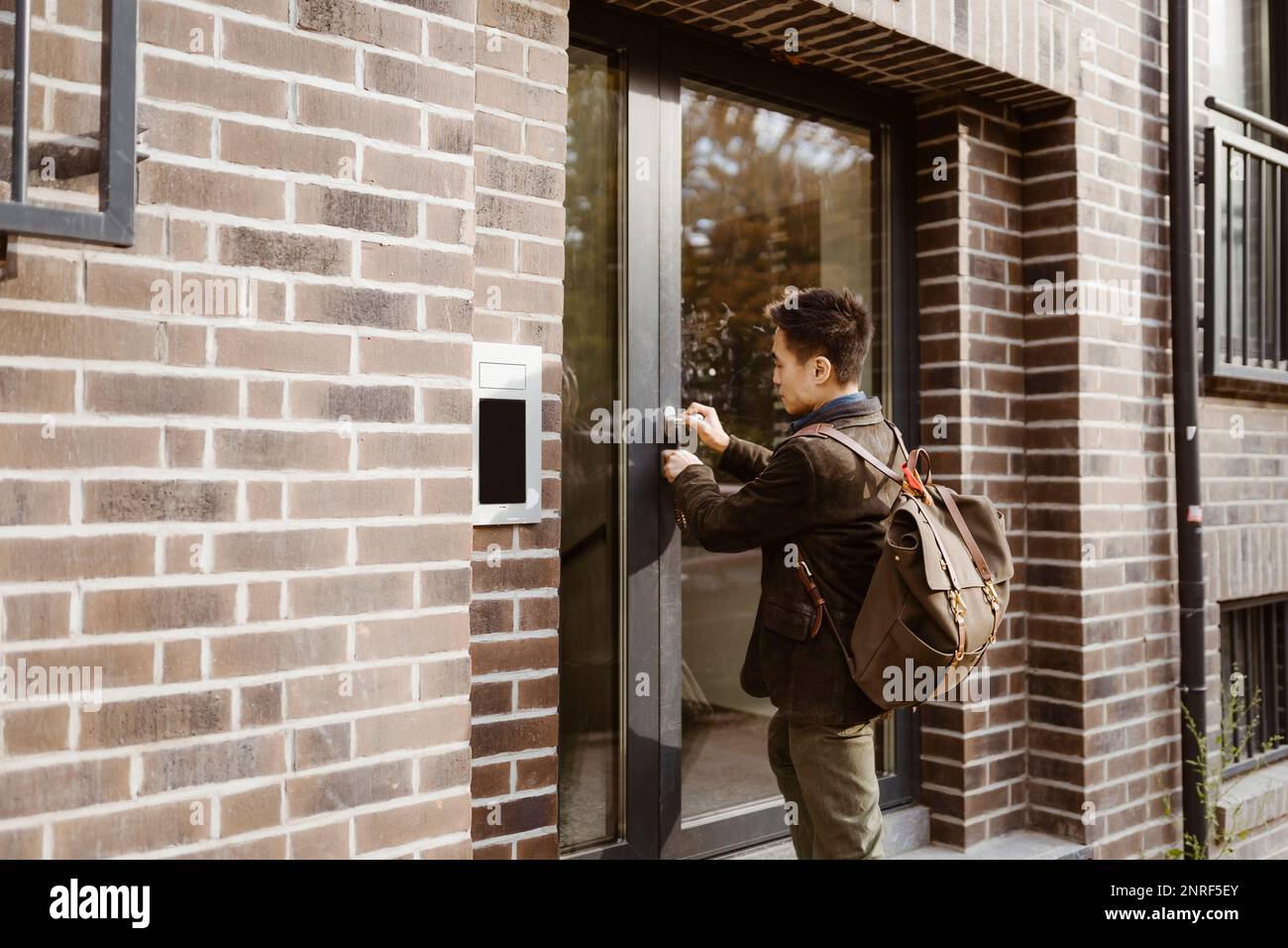 Men outside apartment hires stock photography and images Alamy