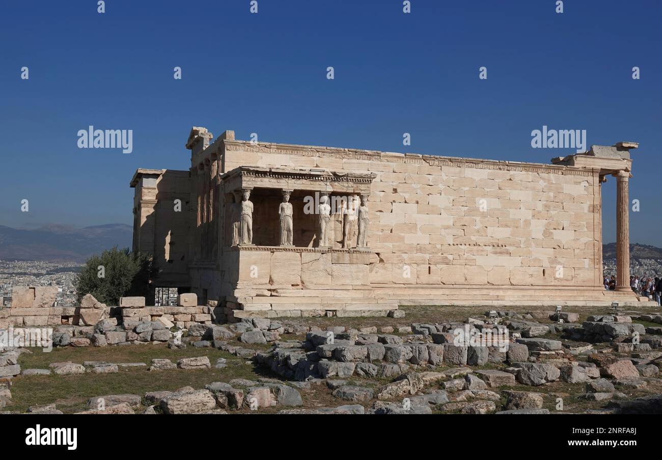 The Erechtheion or Temple of Athena Polias, an ancient Greek Ionic temple-telesterion on the north side of the Acropolis, Athens, which was primarily Stock Photo