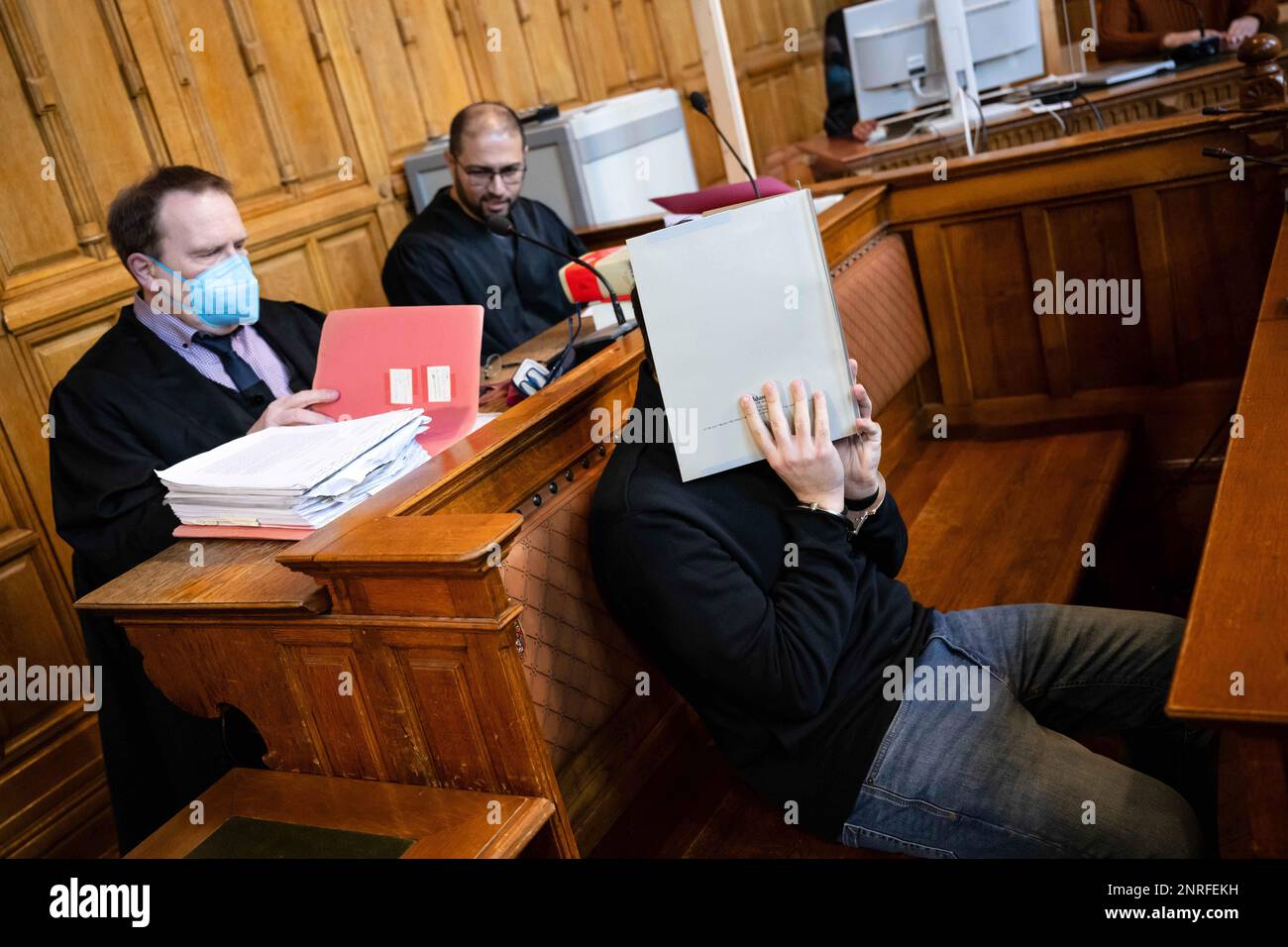 Bremen, Germany. 27th Feb, 2023. The defendant sits in the courtroom