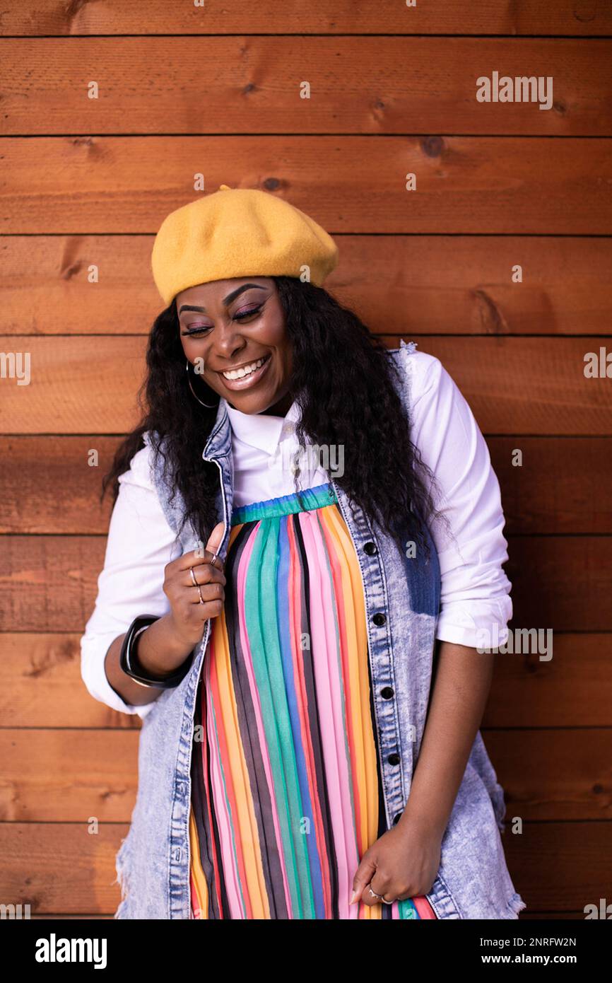 Colorful joyful stylish mature Black woman Stock Photo