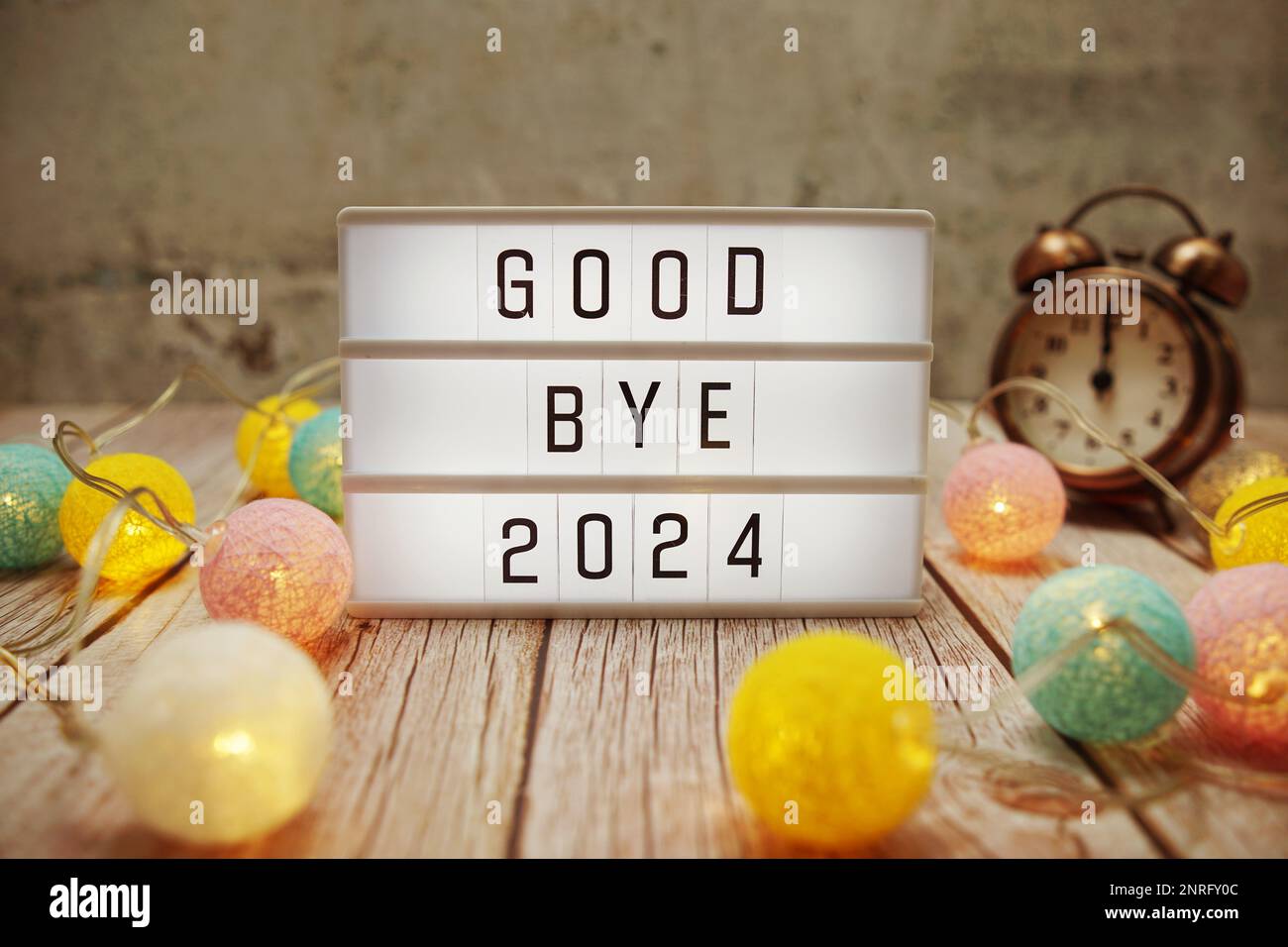 Goodbye 2024 text on lightbox on wooden background Stock Photo Alamy