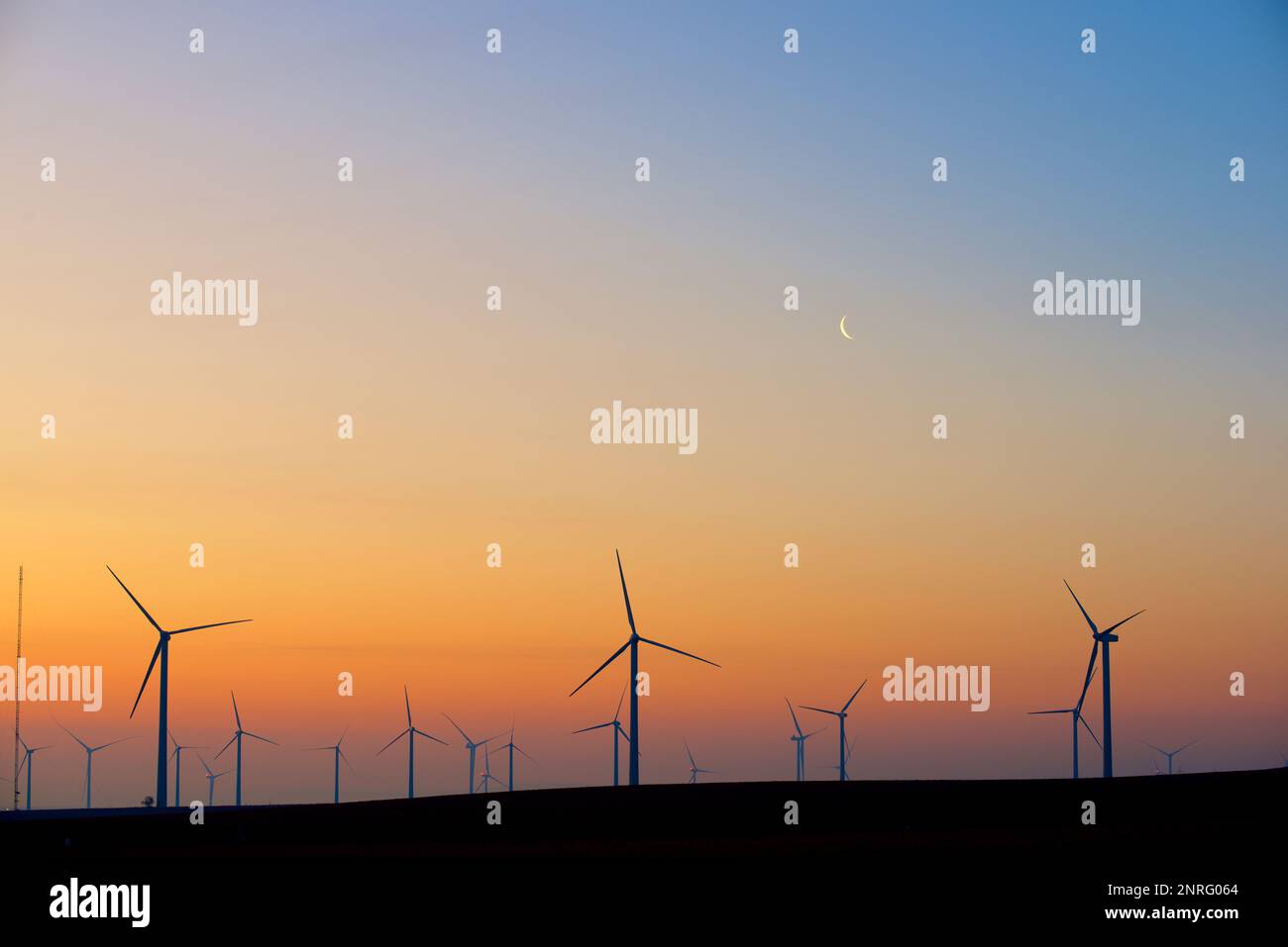 Silhouettes of a group of wind turbines at sunrise Stock Photo - Alamy