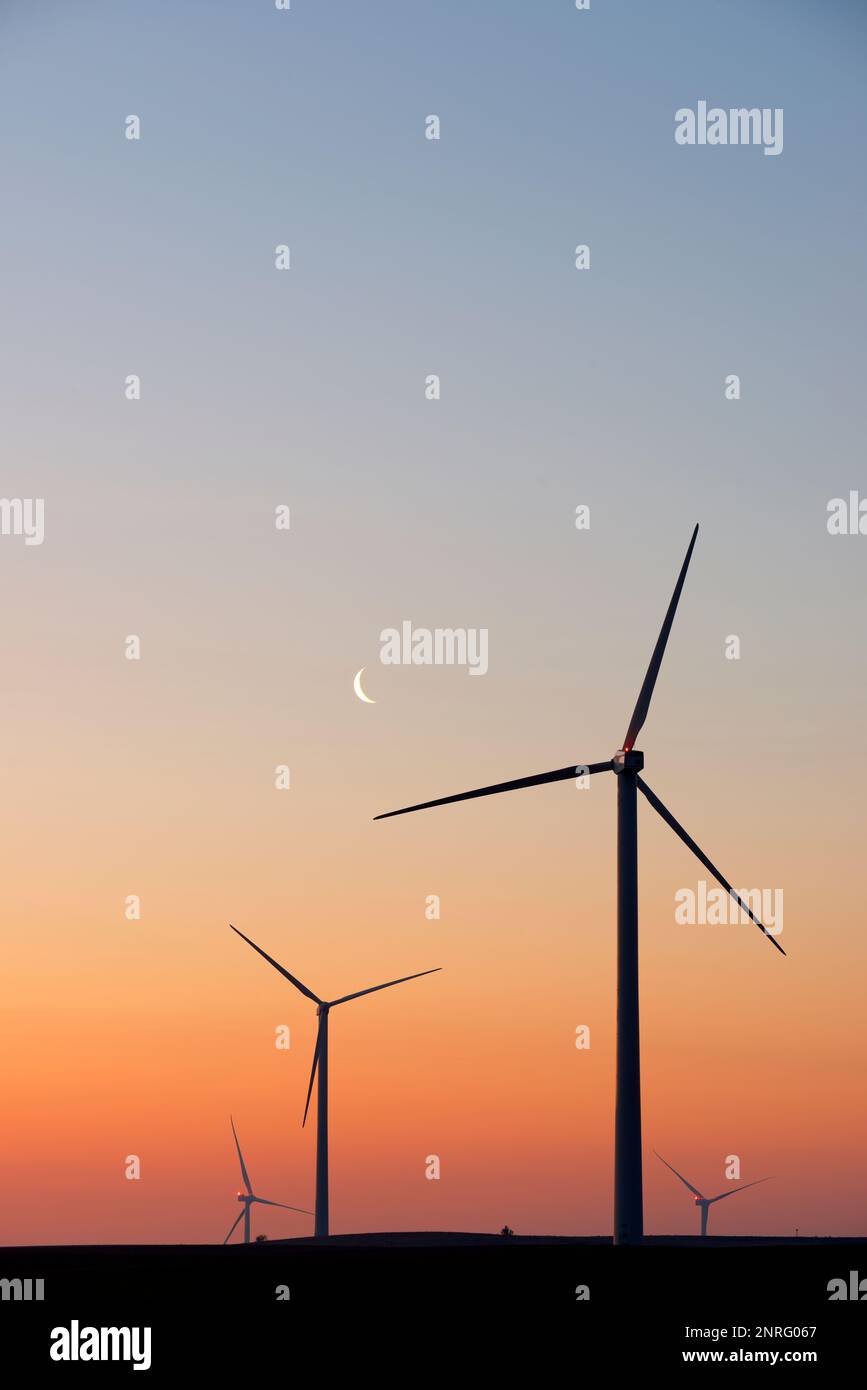 Silhouettes of a group of wind turbines at sunrise Stock Photo - Alamy