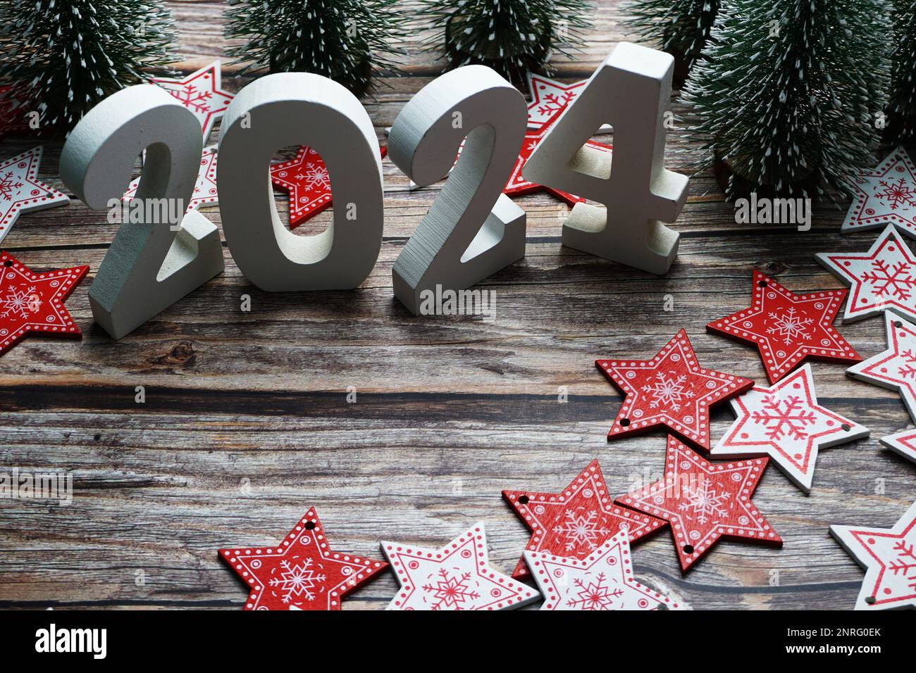 2024 Happy New Year and Christmas decoration on wooden background Stock  Photo - Alamy