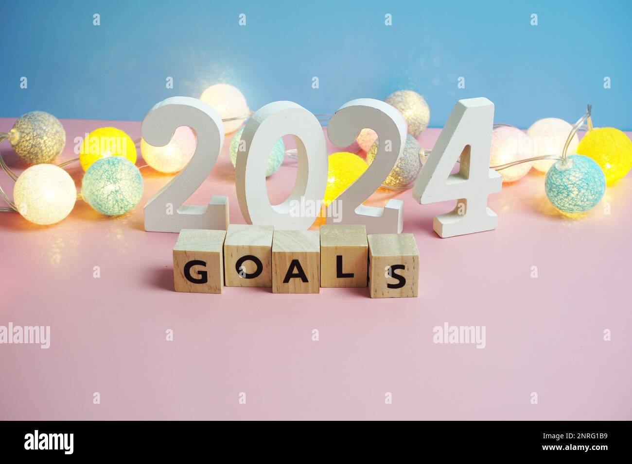 Goals 2024 word alphabet letters on blue and pink background Stock