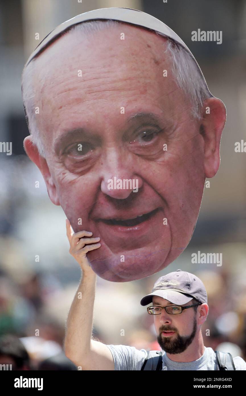 A man holds a big portrait of pope Francis during the weekly general audience at Saint Peter's square at the Vatican on May 21, 2014. Photo by Eric Vandeville/ABACAPRESS.COM Stock Photo