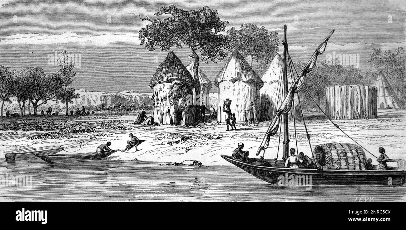 Nuer Village or African Village of Round Mud Huts on the Banks of the Bahr el Ghazal River in the White Nile Region of  South Sudan Africa. Vintage Engraving or Illustration 1862 Stock Photo