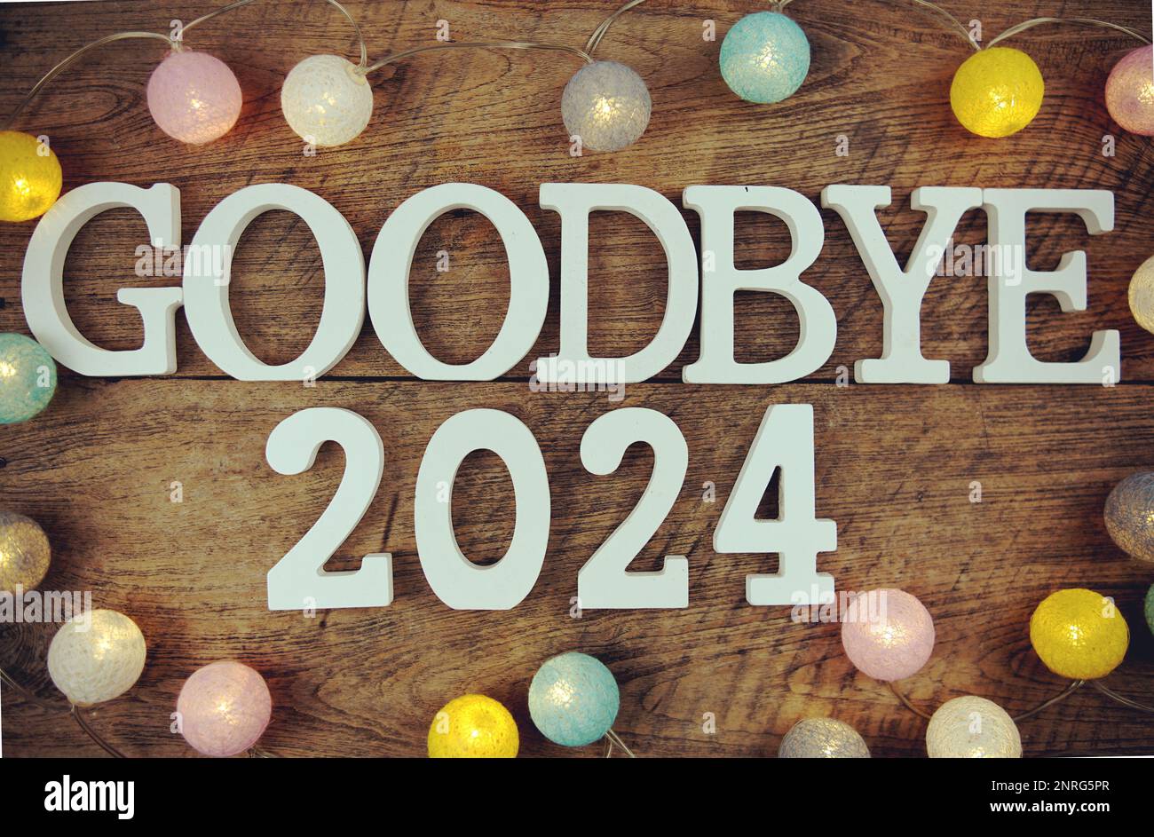 Goodbye 2024 Alphabet Letters And LED Cotton Ball Decoration On Wooden   Goodbye 2024 Alphabet Letters And Led Cotton Ball Decoration On Wooden Background 2NRG5PR 