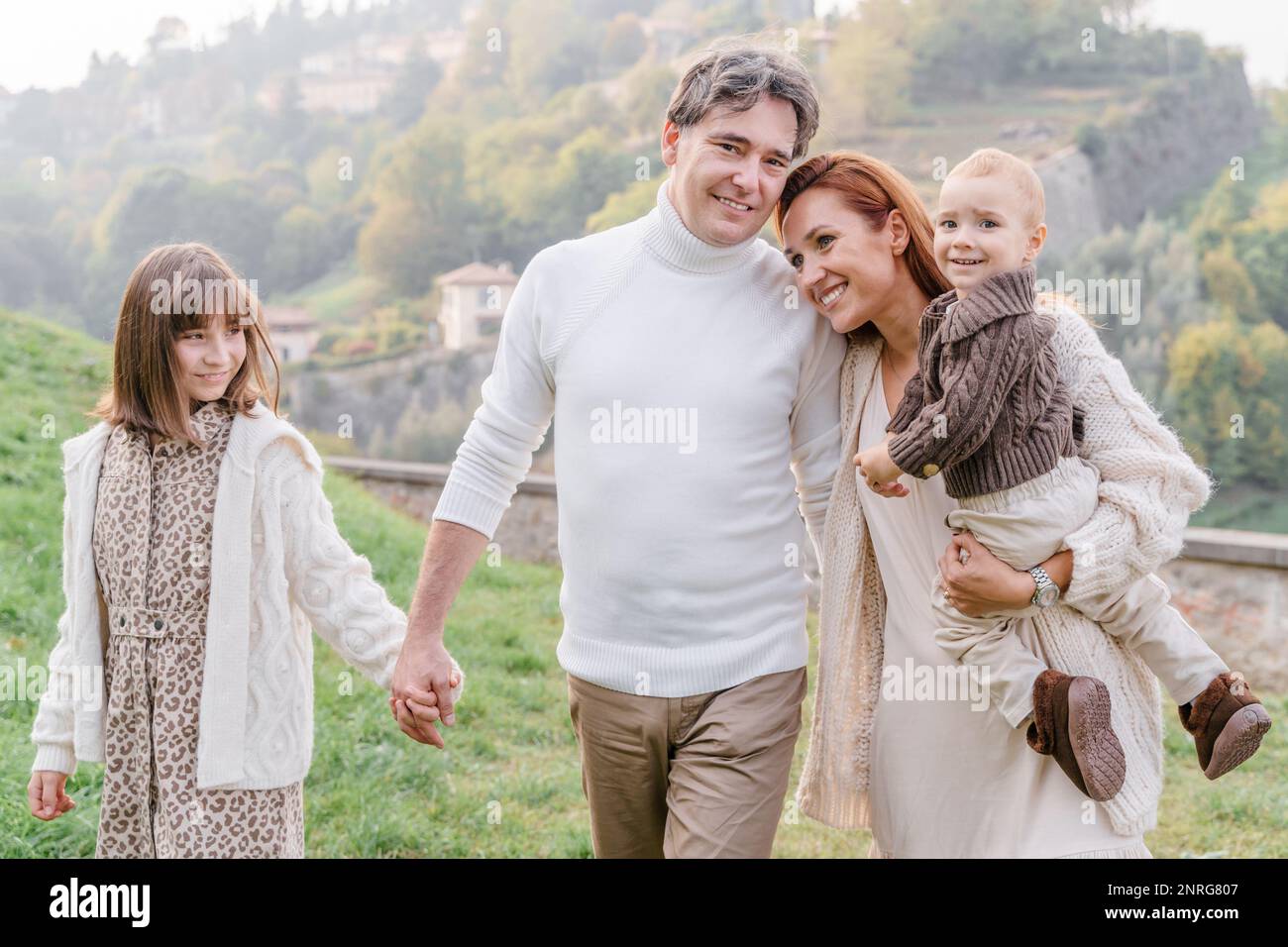 A happy family with two children in a view point of Bergamo, Italy Stock Photo