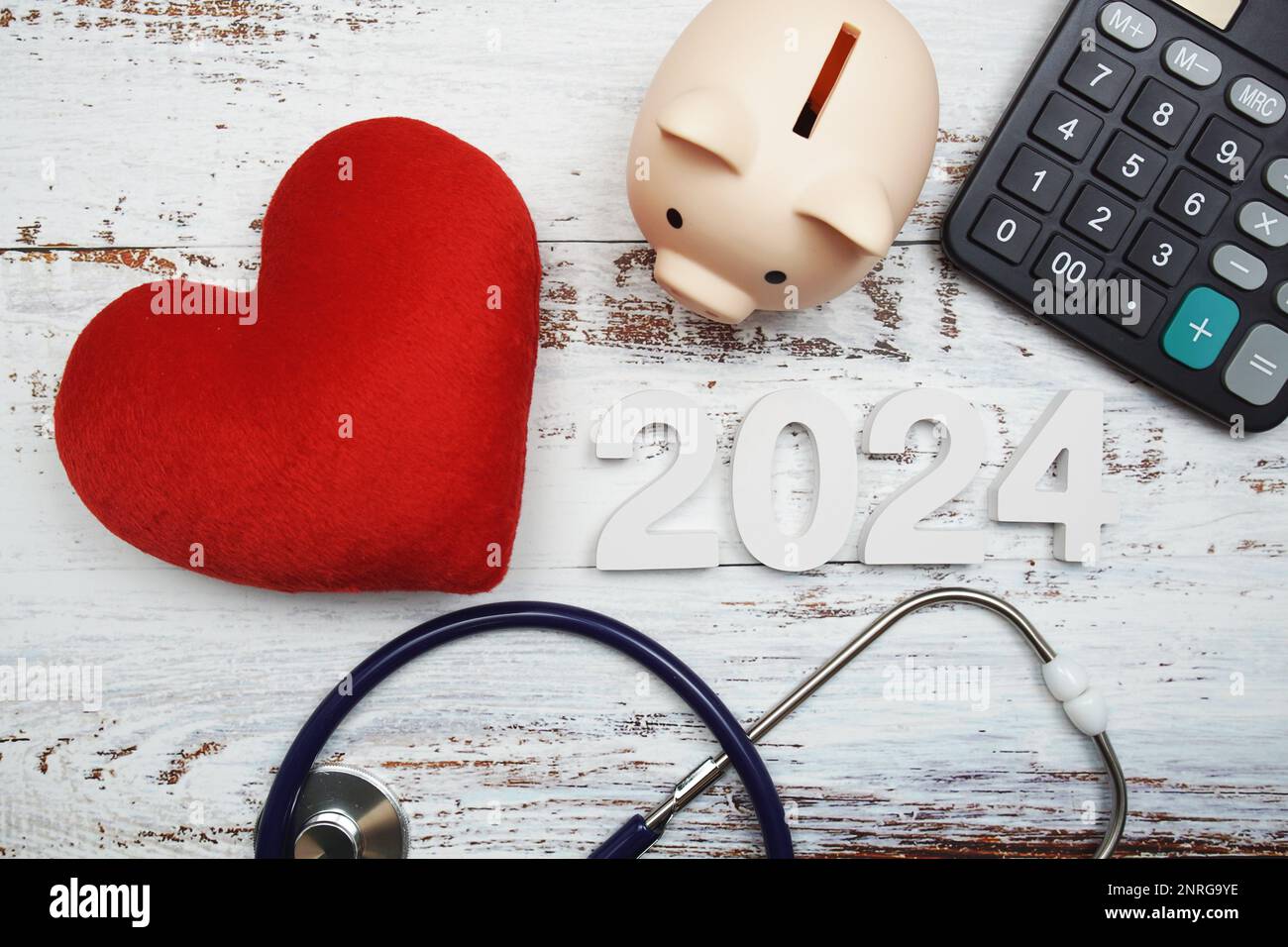 Happy New Year 2024 for healthcare and medical with piggy bank