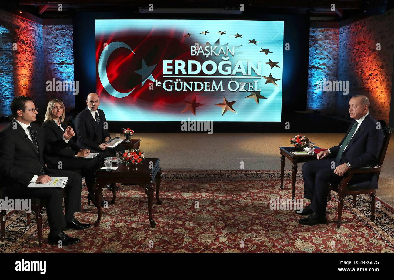 Turkey's President Recep Tayyip Erdogan, right, speaks during an interview with private A Haber