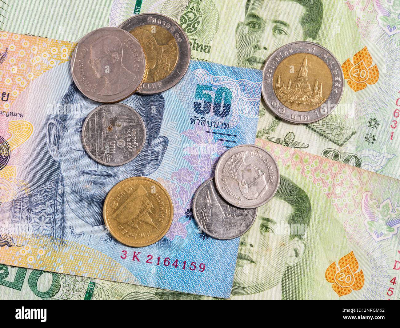 macro-detail-with-a-50-thai-baht-banknote-and-different-coins-the-baht