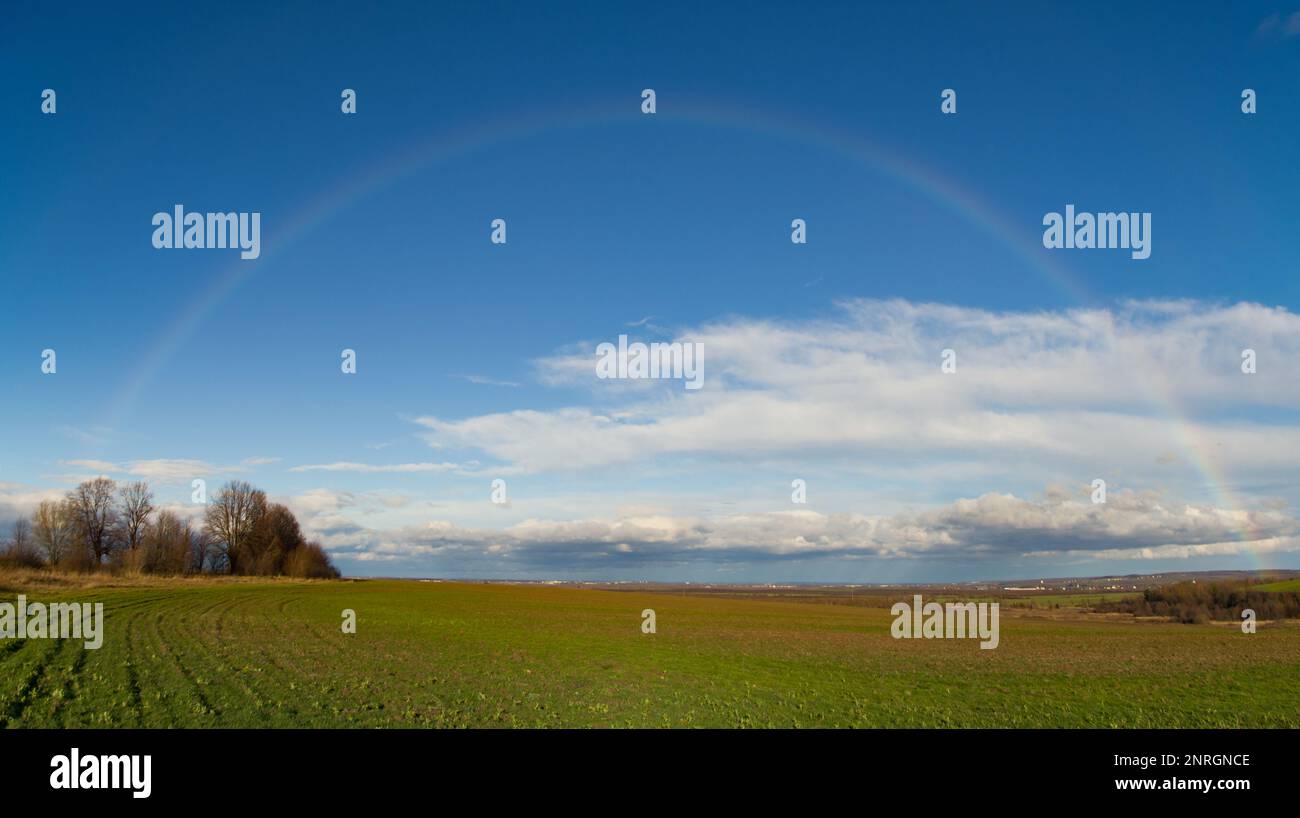 Rainbow Rural landscape with rape field. Close up Stock Photo - Alamy