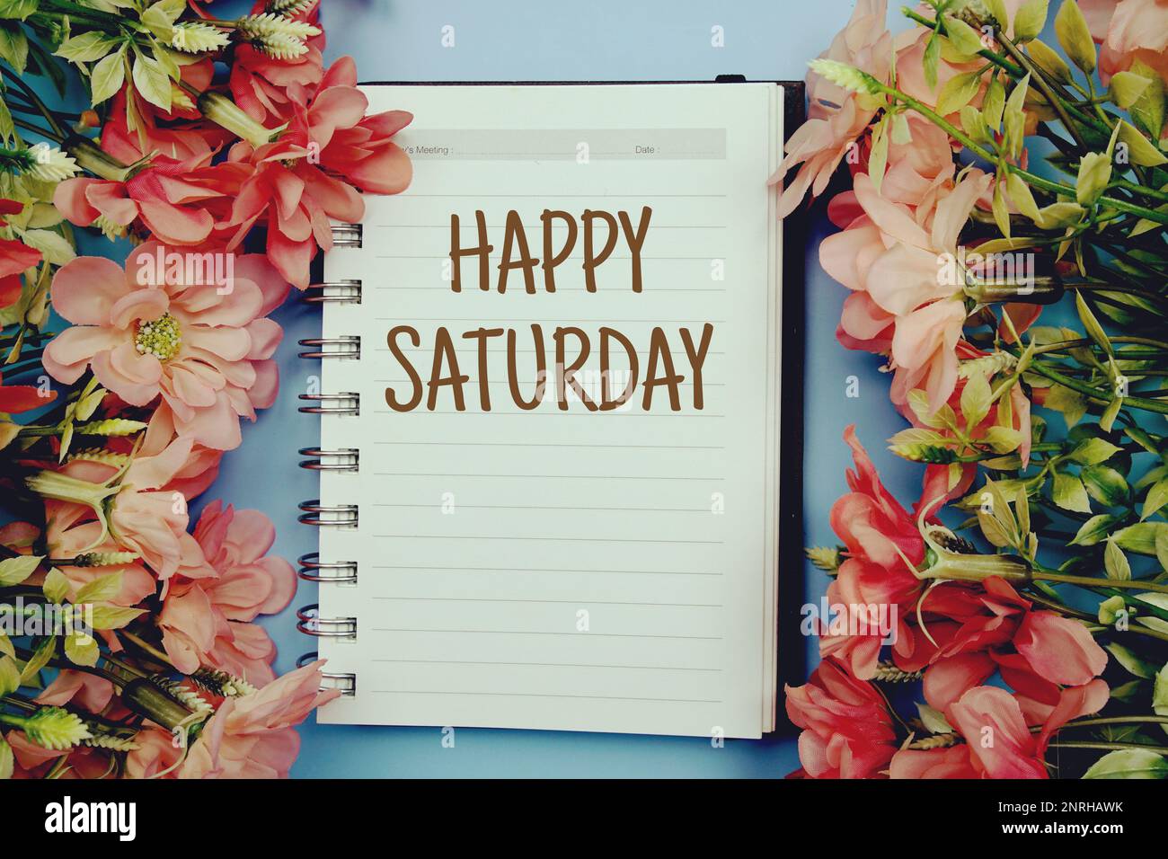 Happy Saturday typography text on paper notebook flat lay on blue  background Stock Photo - Alamy