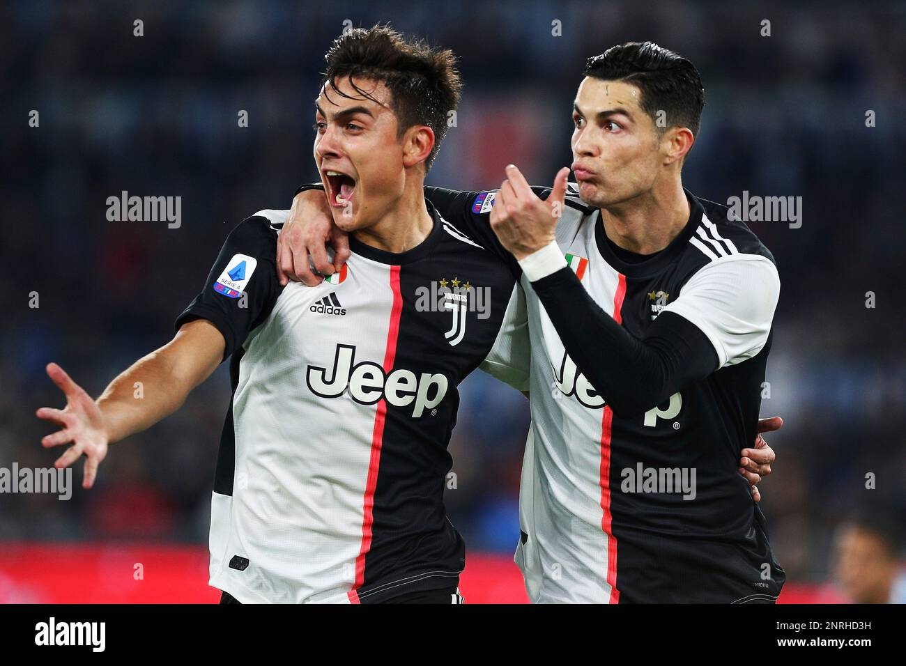 Cristiano Ronaldo of Juventus celebrates with Paulo Dybala after scoring  0-1 goal during the Italian championship Serie A football match between SS  Lazio and Juventus on December 7, 2019 at Stadio Olimpico