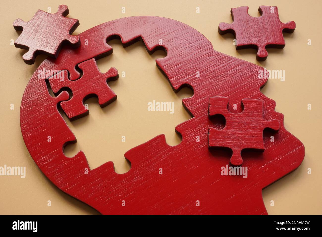 A head made of puzzle pieces as a symbol of mental illness, stress and ...