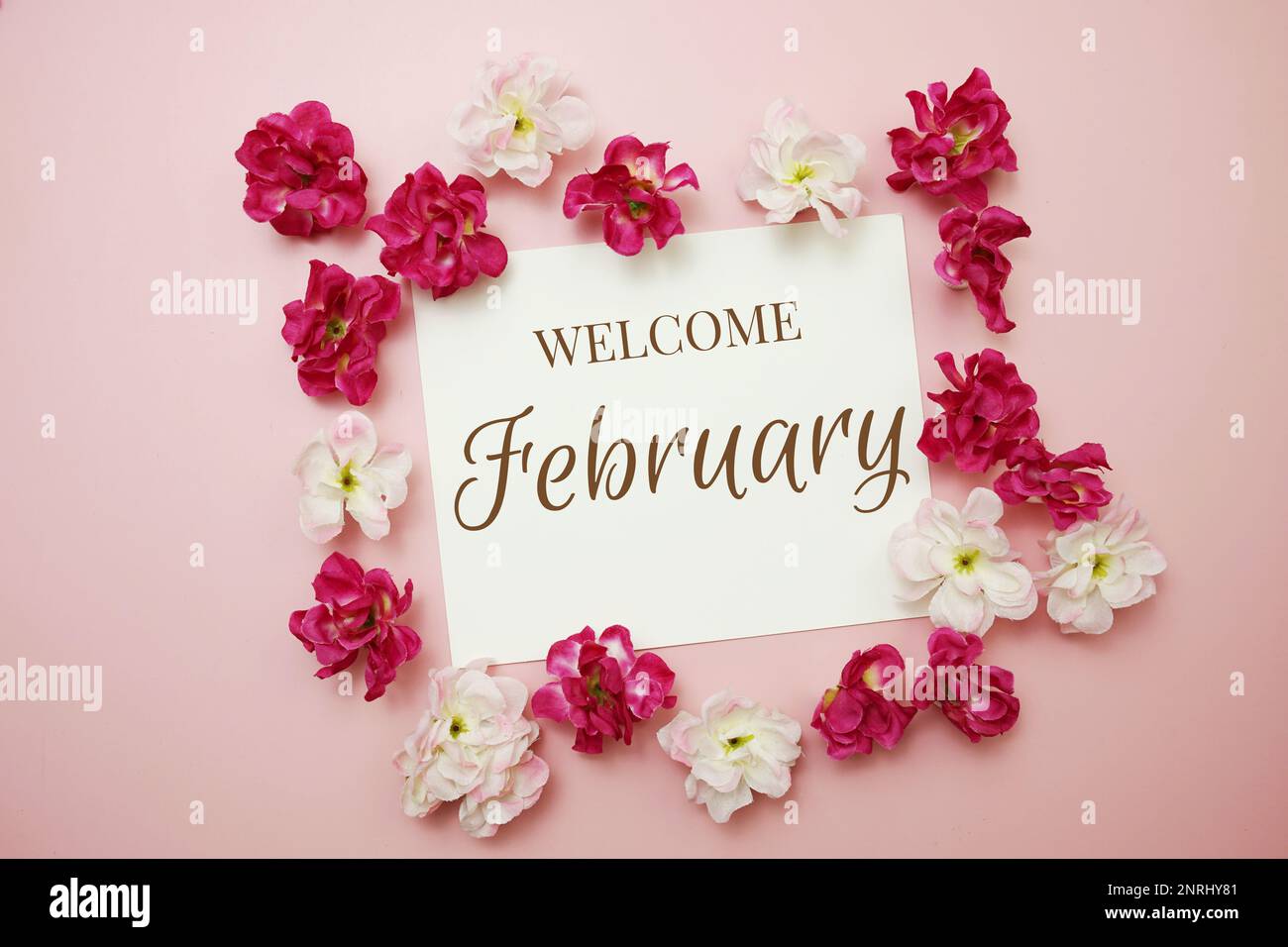 February card typography text with flower bouquet on pink