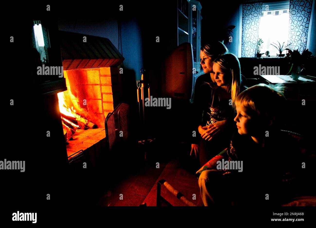 After the storm Per. Family from Grebo, where a mother is at home with the children, who have been allowed to go home from school, during a power outage. Stock Photo