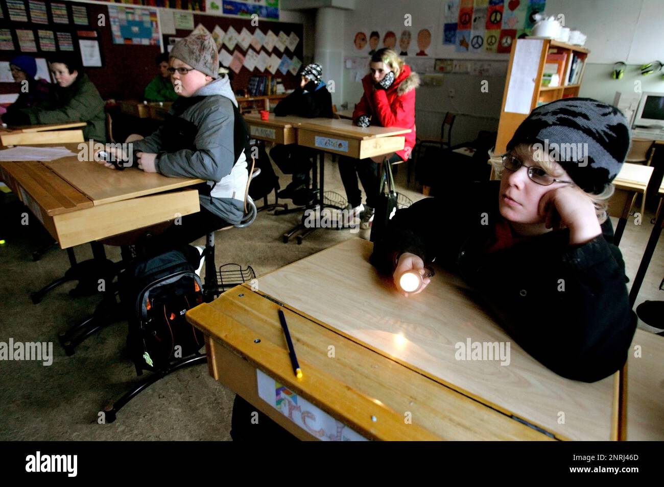 After the storm Per. Children in a dark classroom at Björsäters school, Sweden, during a power outage after the storm Stock Photo