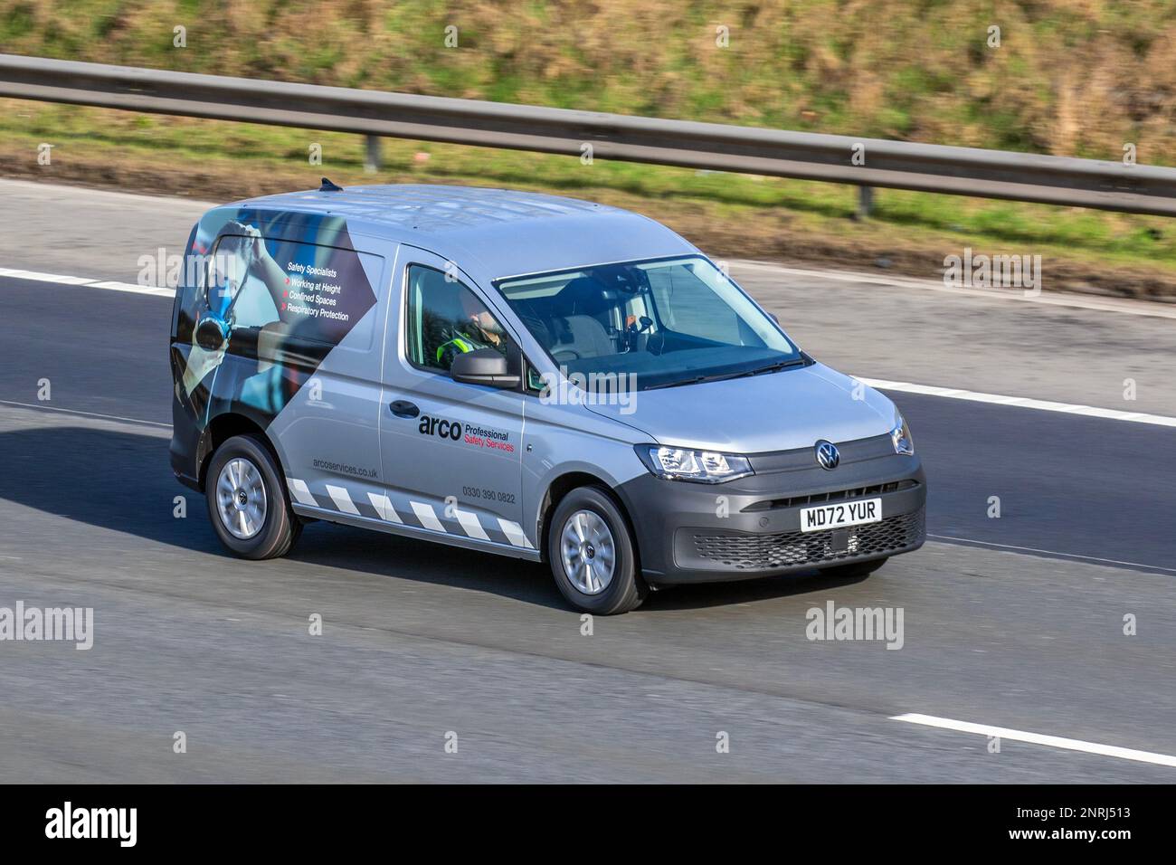ARCO, a supplier of safety equipment, workwear, safety boots and shoes, gloves and maintenance supplies.  2023 VW VOLKSWAGEN CADDY C20 COMMERCE TDI 1968cc Diesel 6 speed manual; travelling on the M6 motorway, UK Stock Photo