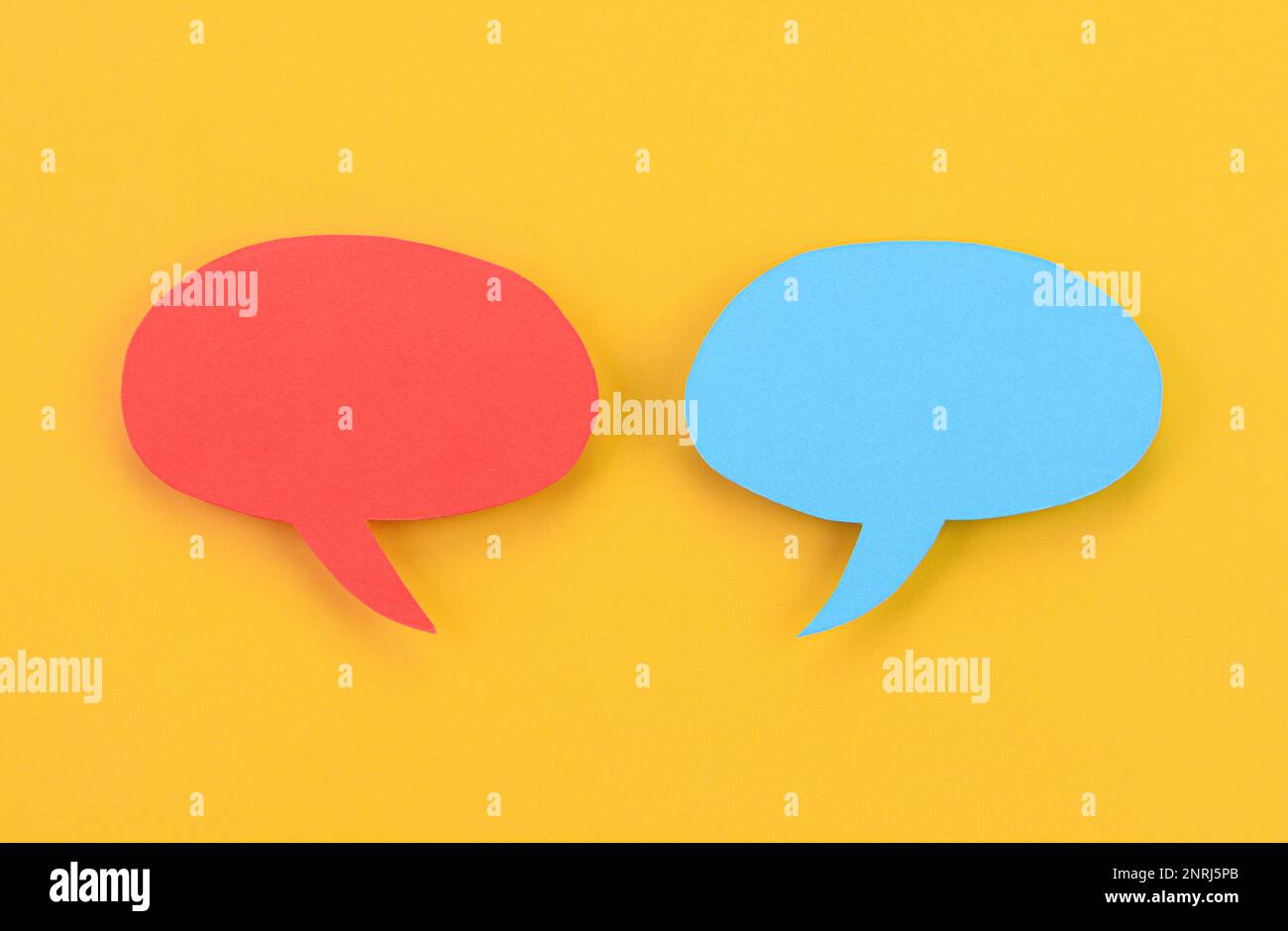 Speech bubbles arranged on a yellow background Stock Photo