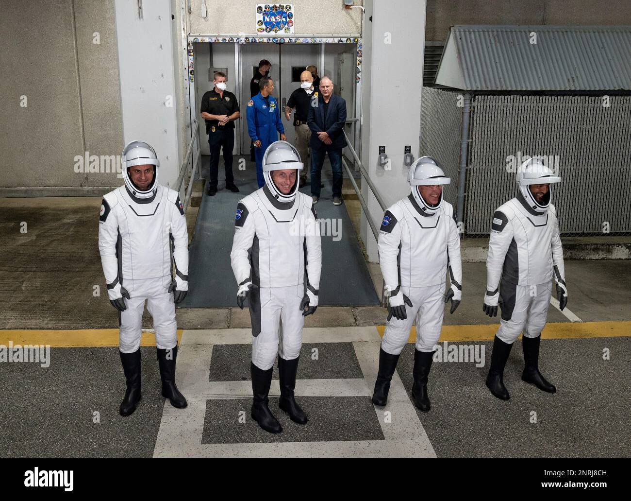 Cape Canaveral, United States of America. 23 February, 2023. Astronauts from left; Andrey Fedyaev of Roscosmos, Woody Hoburg, and Stephen Bowen, of NASA, and Sultan Alneyadi of the United Arab Emirates depart the Neil  Armstrong Operations and Checkout Building to board the SpaceX Dragon spacecraft for launch at the Kennedy Space Center, February 26, 2023 in Cape Canaveral, Florida. The NASA SpaceX Crew-6 mission to the International Space Station was scrubbed after a problem with the TEA-TEB ground system was detected delaying launch until March 2nd.  Credit: Joel Kowsky/NASA/Alamy Live News Stock Photo