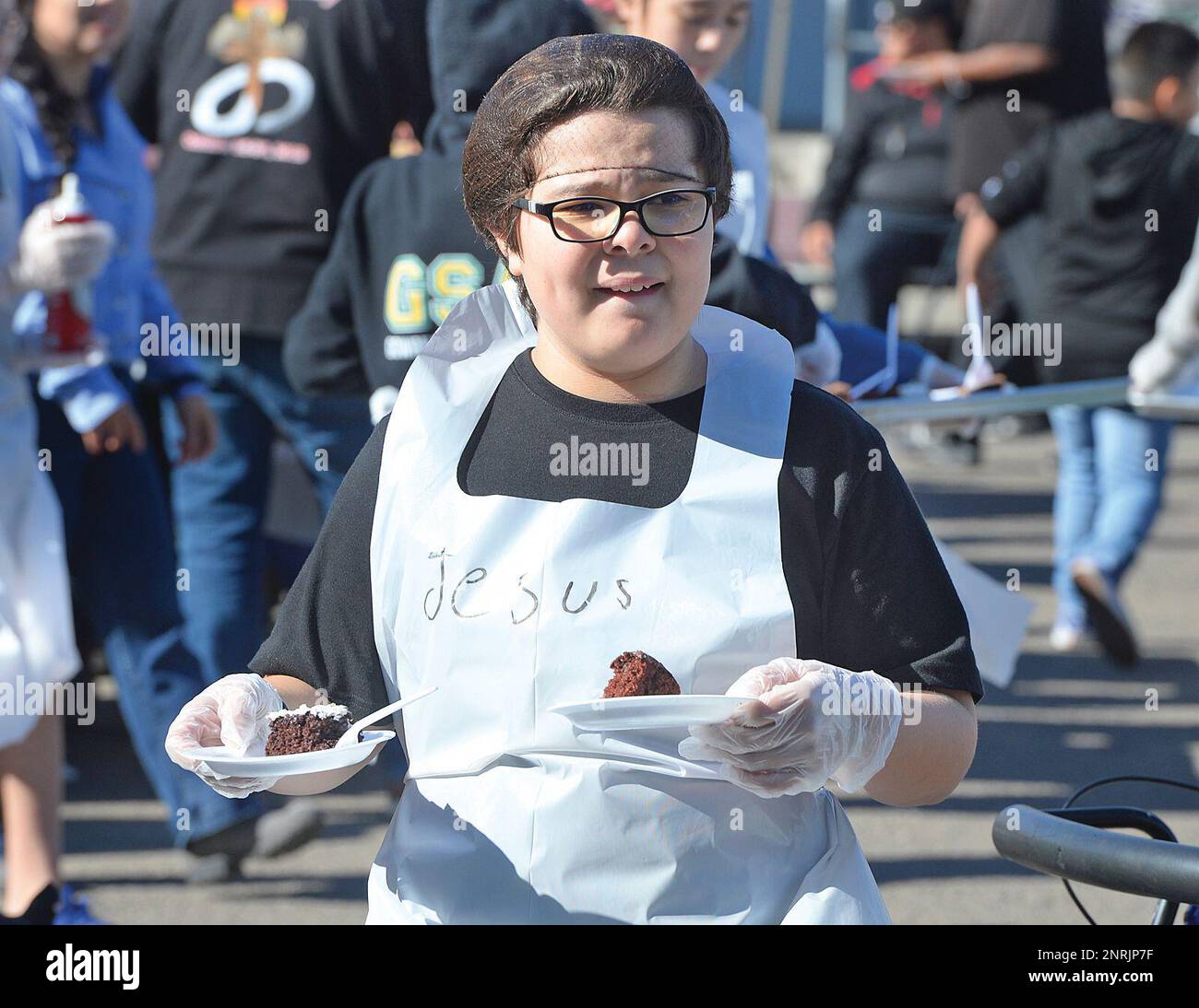 Jesus Romero, a student at Gowan Science Academy, delivers desserts early during Tuesday's