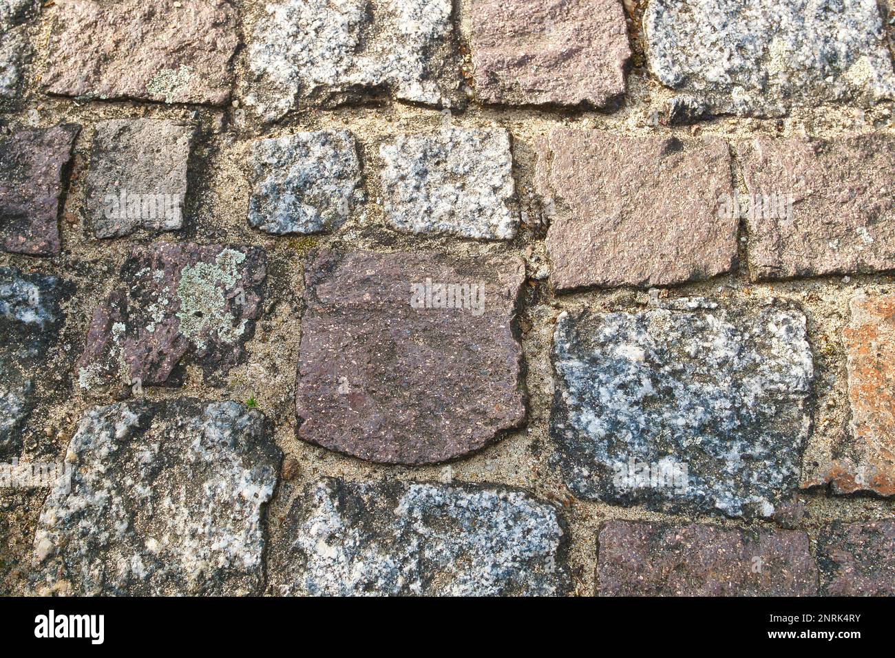 cobblestone natural stone with sand joints. Background image. Stone floor with natural stones. Detail image Stock Photo