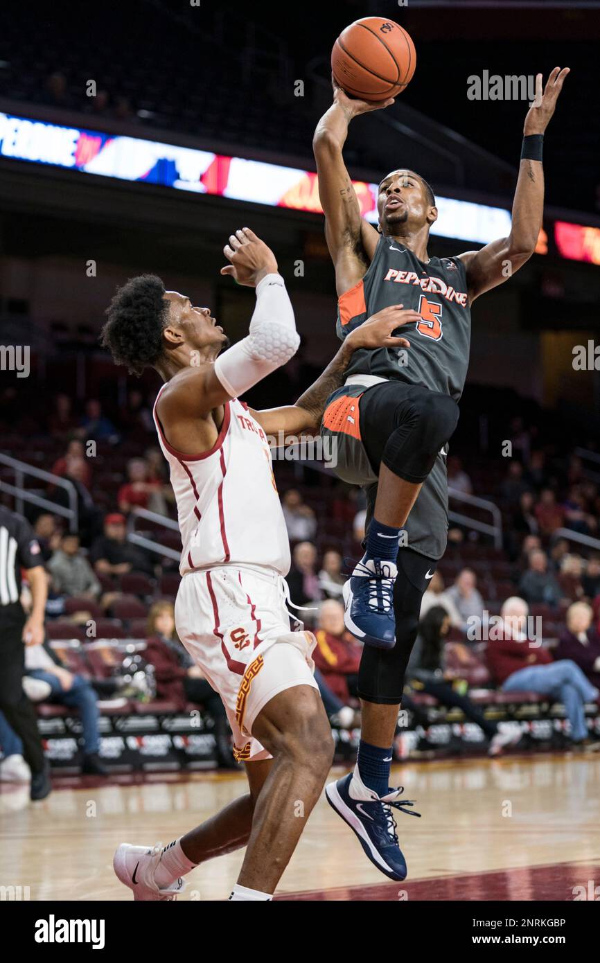LOS ANGELES, CA - NOVEMBER 19: Pepperdine Waves guard Jade Smith (5) shoots  over USC Trojans forward Onyeka Okongwu (21) during a college basketball  game between the Pepperdine Waves and the USC