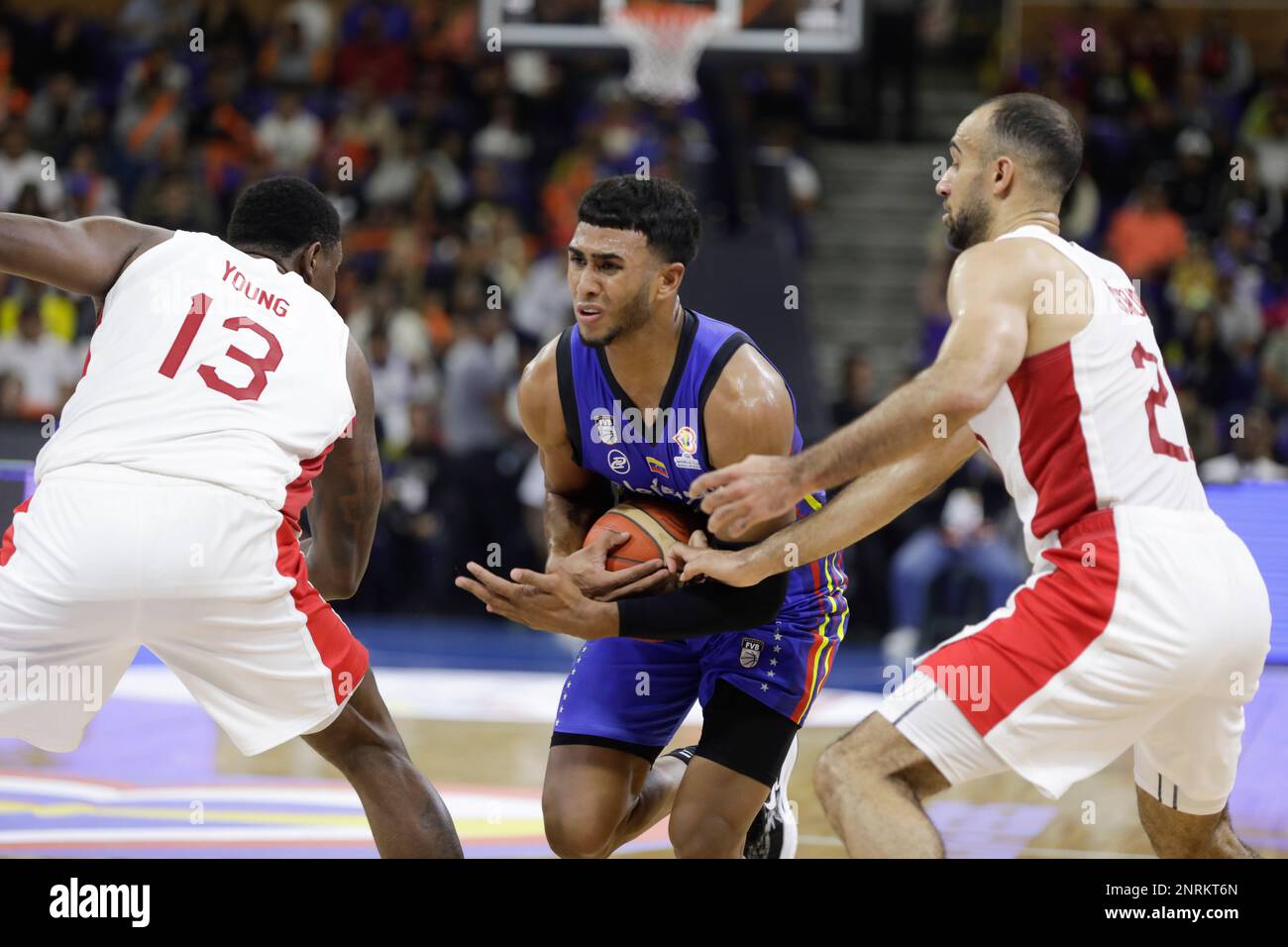 CARACAS, VENEZUELA - FEBRUARY 26: Garly Sojo of Venezuela competes for the ball with Phil Scrubb of Canada during the FIBA Basketball World Cup 2023 Americas Qualifiers basketball game, Poliedro de Caracas, in Caracas, Venezuela, on February 26, 2023. (Photo by Pedro Rances Mattey/Pximages) Credit: Px Images/Alamy Live News Stock Photo