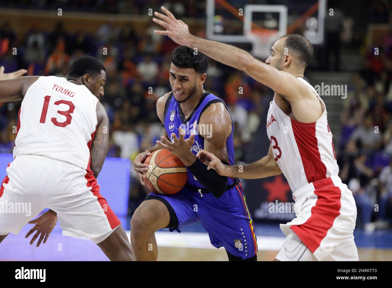 CARACAS, VENEZUELA - FEBRUARY 26: Garly Sojo of Venezuela competes for the ball with Phil Scrubb of Canada during the FIBA ​​Basketball World Cup 2023 Americas Qualifiers basketball game, Poliedro de Caracas, in Caracas, Venezuela, on February 26, 2023. (Photo by Pedro Rances Mattey/Pximages) Credit: Px Images/Alamy Live News Stock Photo