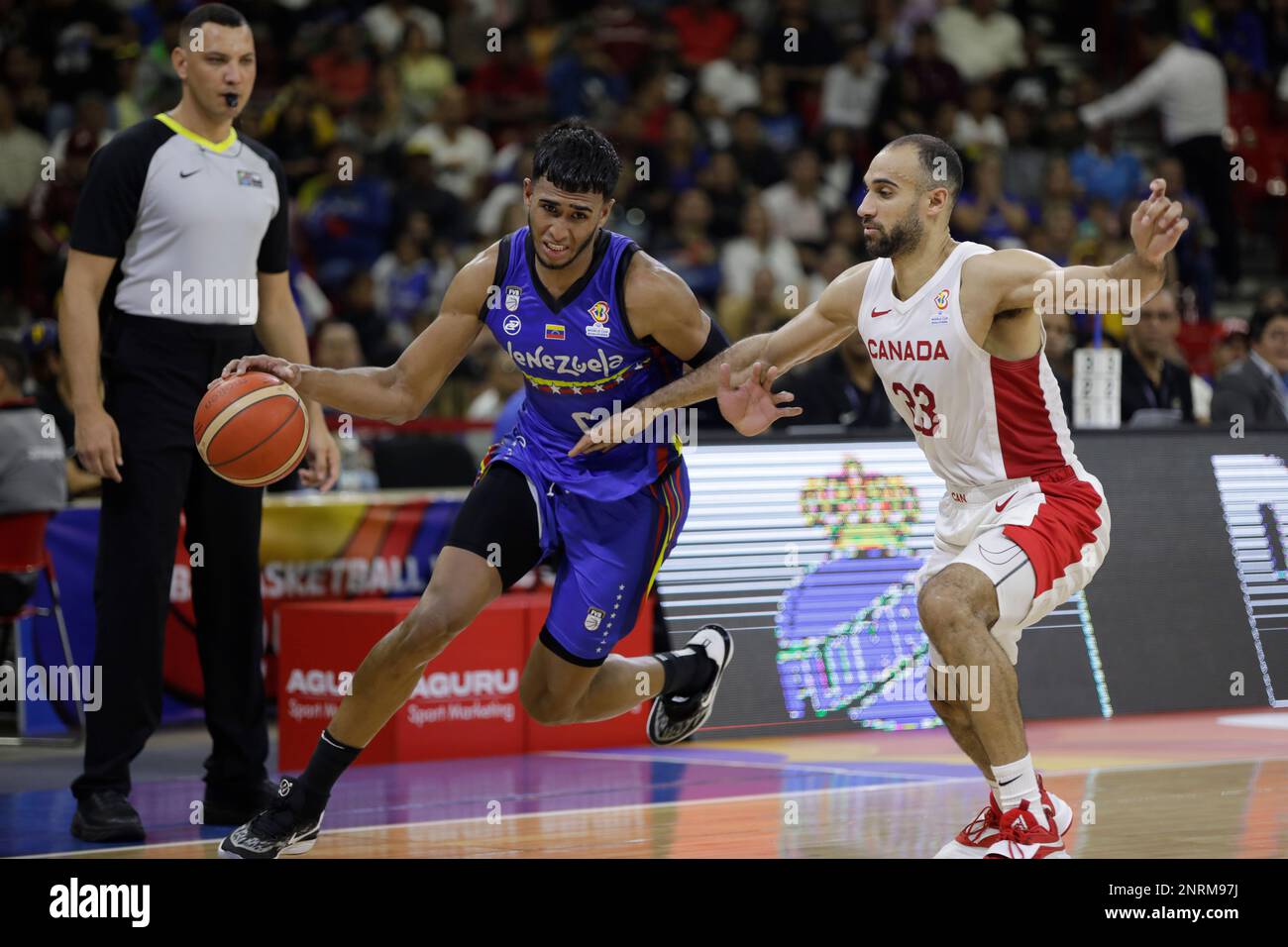 February 26, 2023, Caracas, Caracas/Venezuela, Venezuela: CARACAS, VENEZUELA - FEBRUARY 26: Garly Sojo of Venezuela competes for the ball with Phil Scrubb of Canada during the FIBA ""‹""‹Basketball World Cup 2023 Americas Qualifiers basketball game, Poliedro de Caracas, in Caracas, Venezuela, on February 26, 2023. (Credit Image: © Pedro Rances Mattey/PX Imagens via ZUMA Press Wire) EDITORIAL USAGE ONLY! Not for Commercial USAGE! Stock Photo