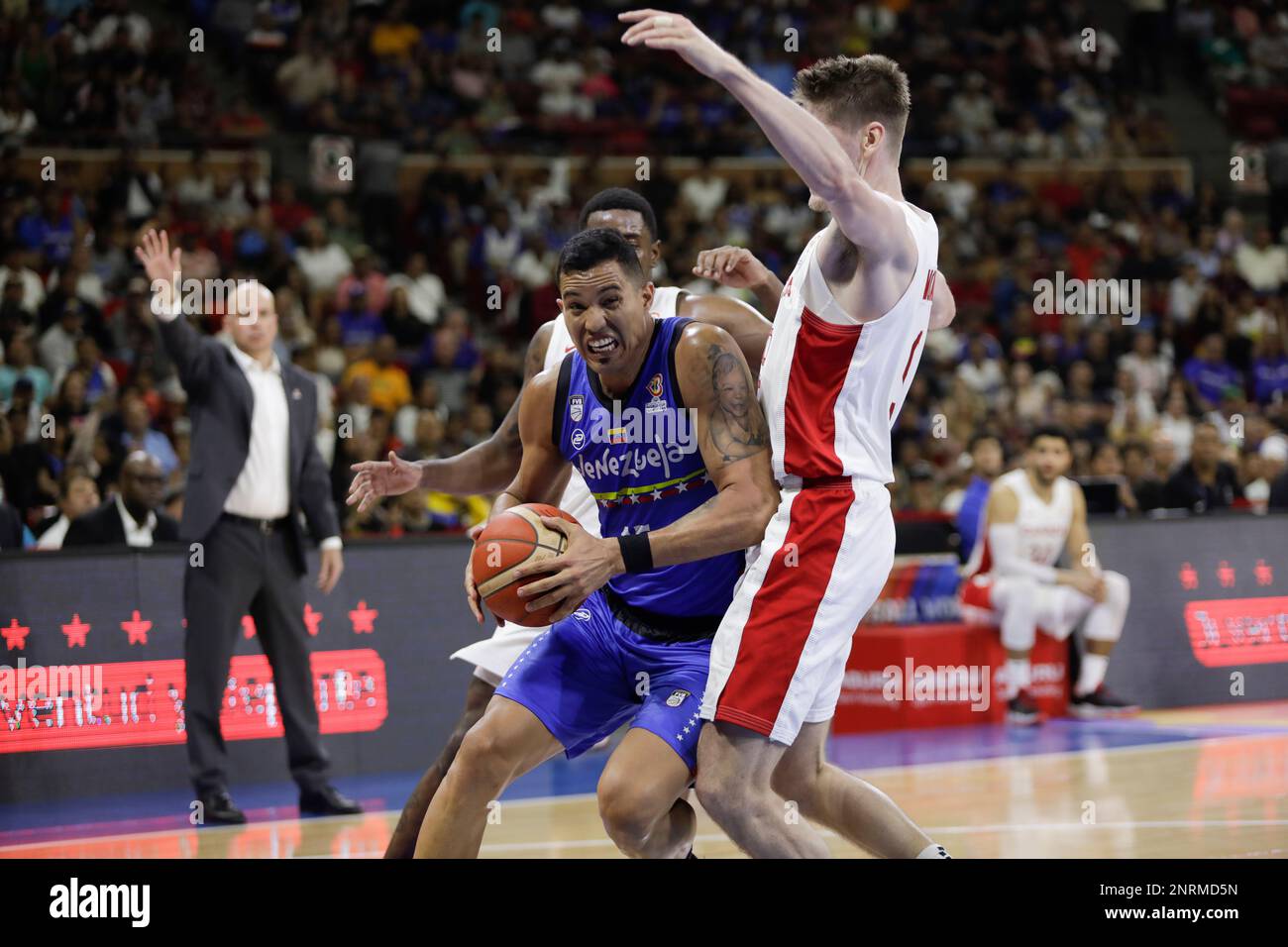 February 26, 2023, Caracas, Caracas/Venezuela, Venezuela: CARACAS, VENEZUELA - FEBRUARY 26: Windi Graterol of Venezuela competes for the ball with Conor Morgan of Canada during the FIBA ''‹''‹Basketball World Cup 2023 Americas Qualifiers basketball game, Poliedro de Caracas, in Caracas, Venezuela, on February 26 of 2023. (Credit Image: © Pedro Rances Mattey/PX Imagens via ZUMA Press Wire) EDITORIAL USAGE ONLY! Not for Commercial USAGE! Stock Photo