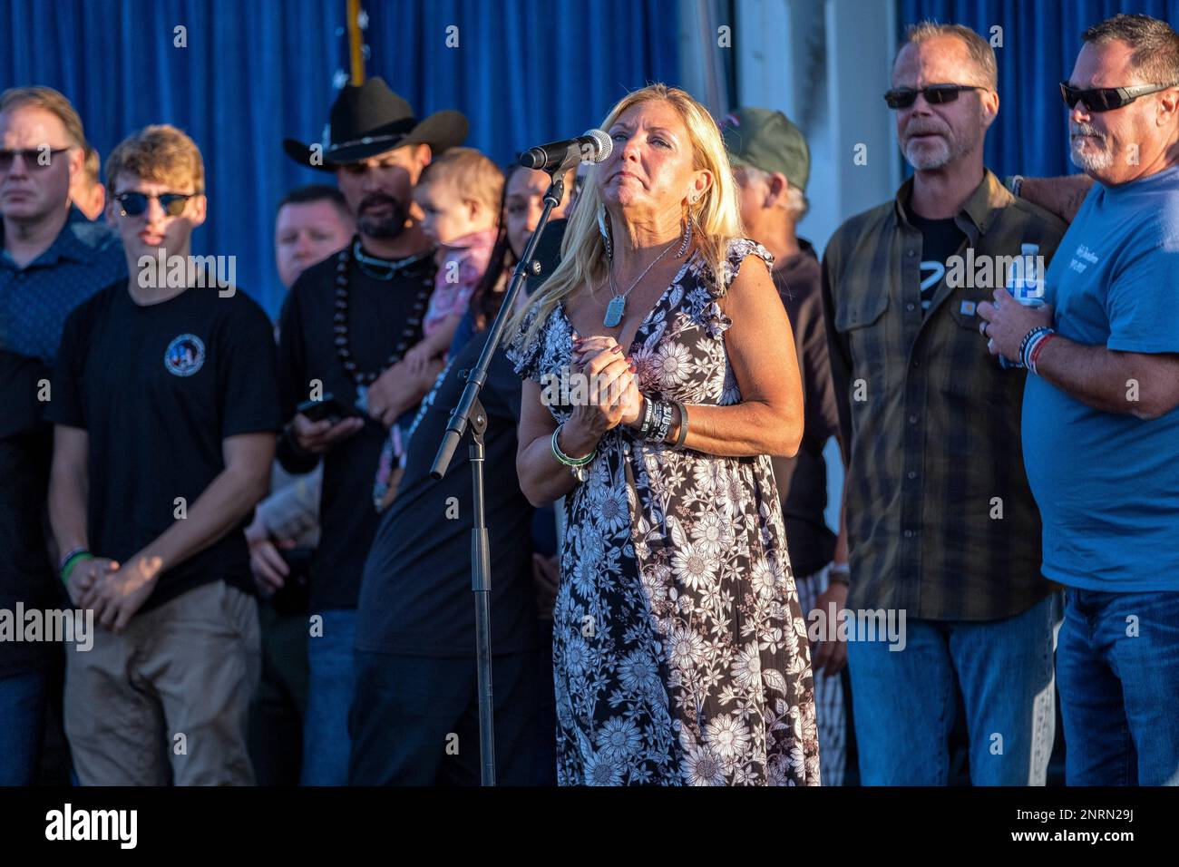 Family members of victims say their names during the dedication of the